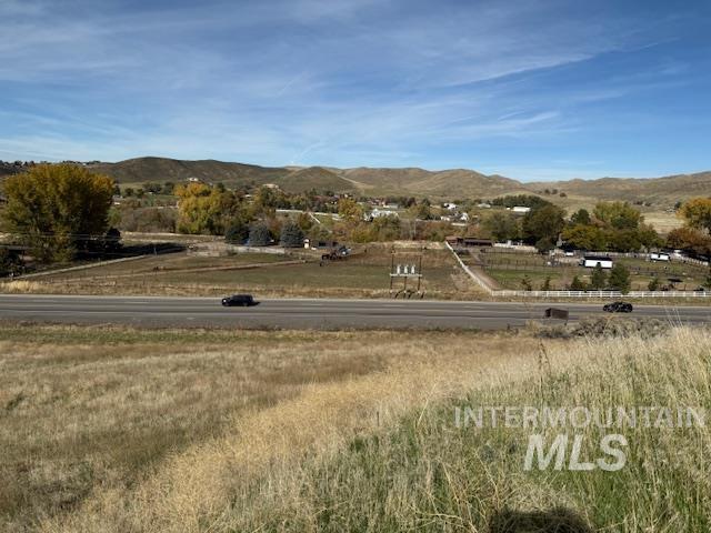 View of mountain backdrop with rural landscape