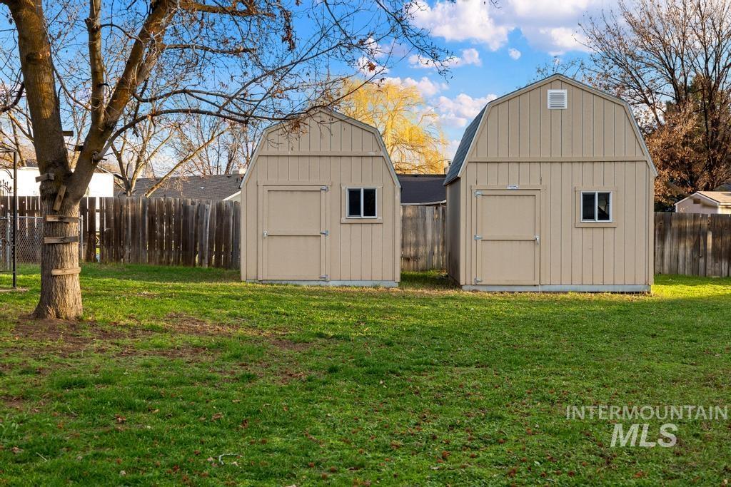 View of shed featuring a fenced backyard