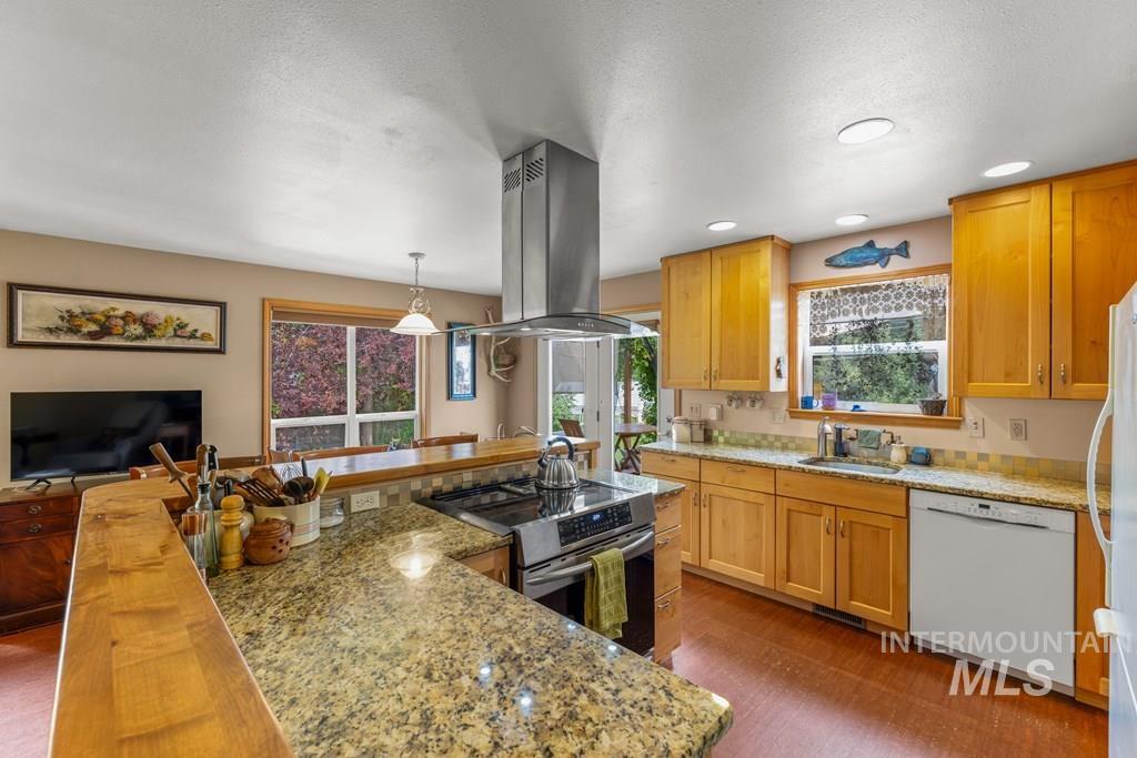 With custom alder cabinets and granite and butcher block counters.