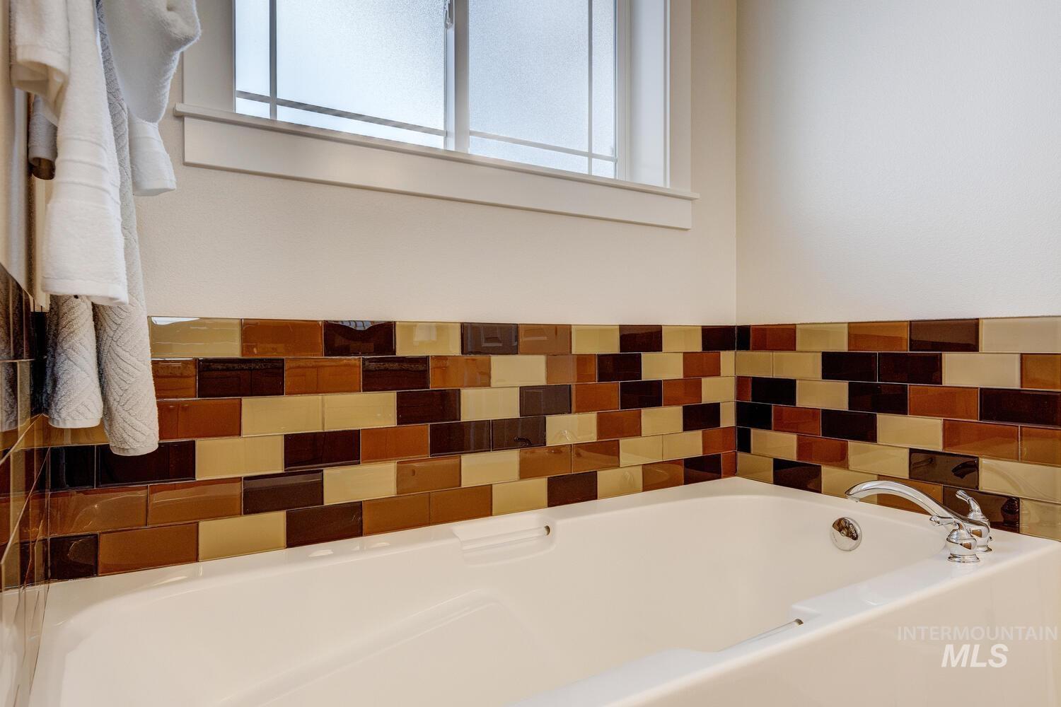 Full bathroom with a garden tub