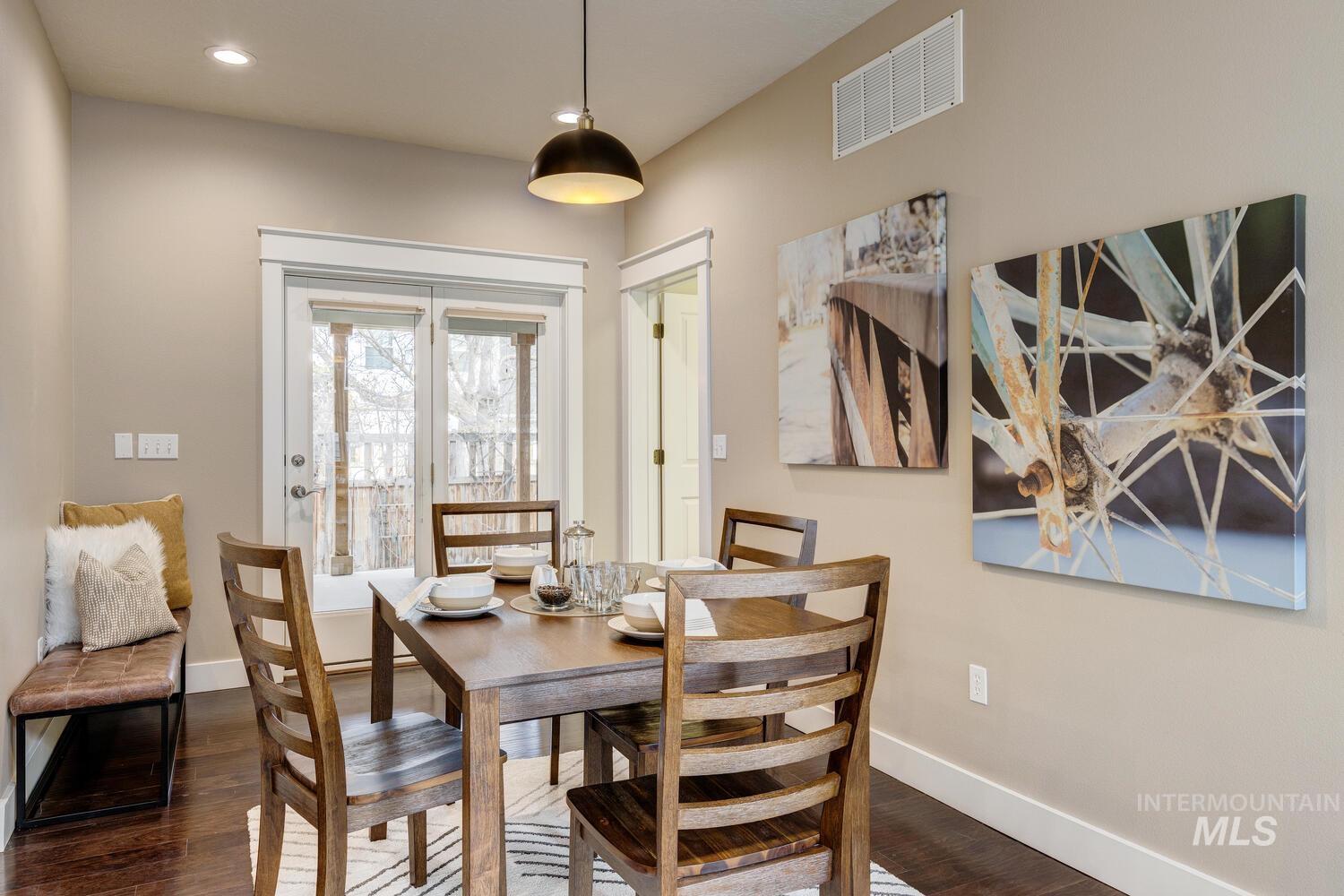 Dining area featuring wood finished floors and recessed lighting