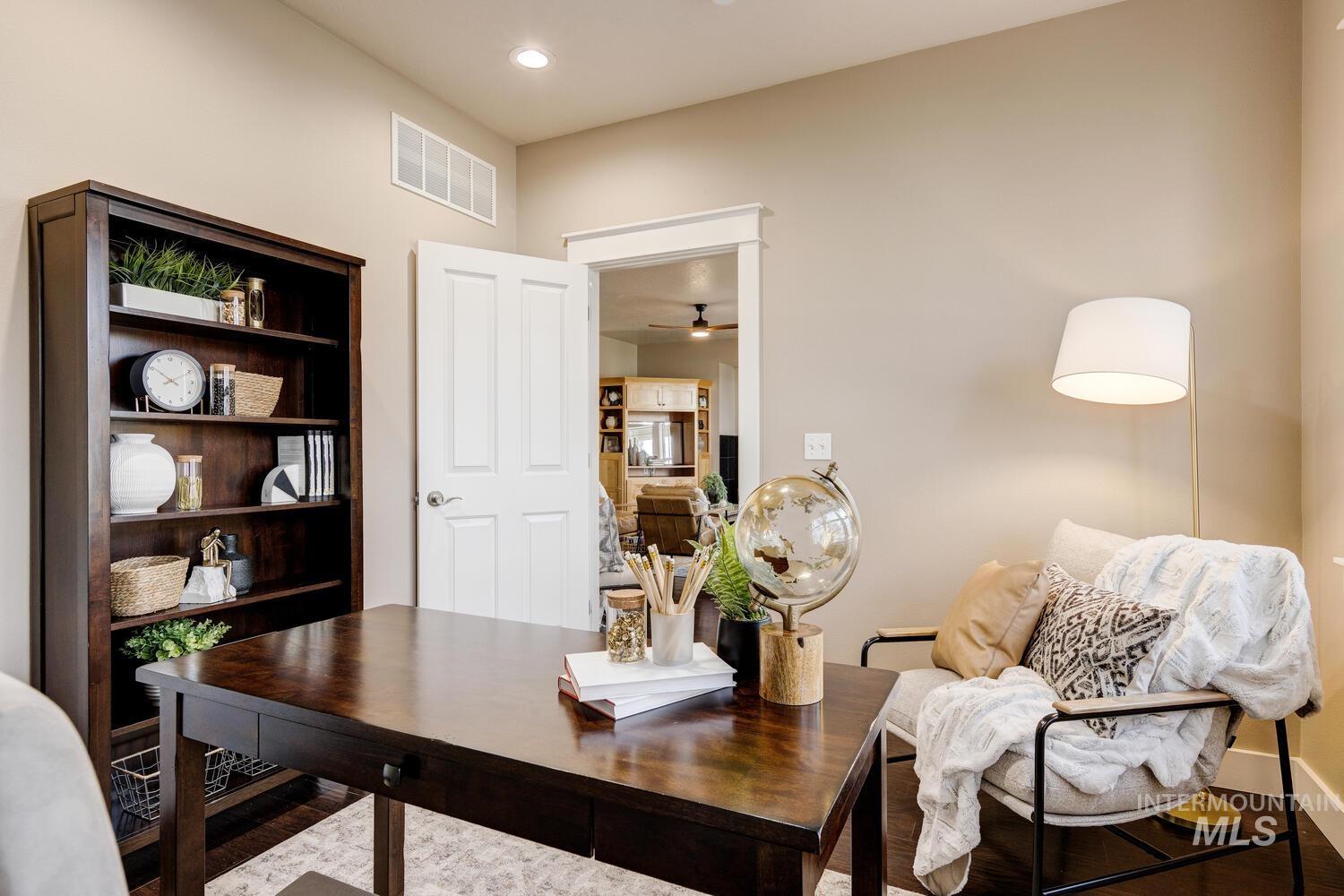 Office space with wood finished floors, a ceiling fan, and recessed lighting
