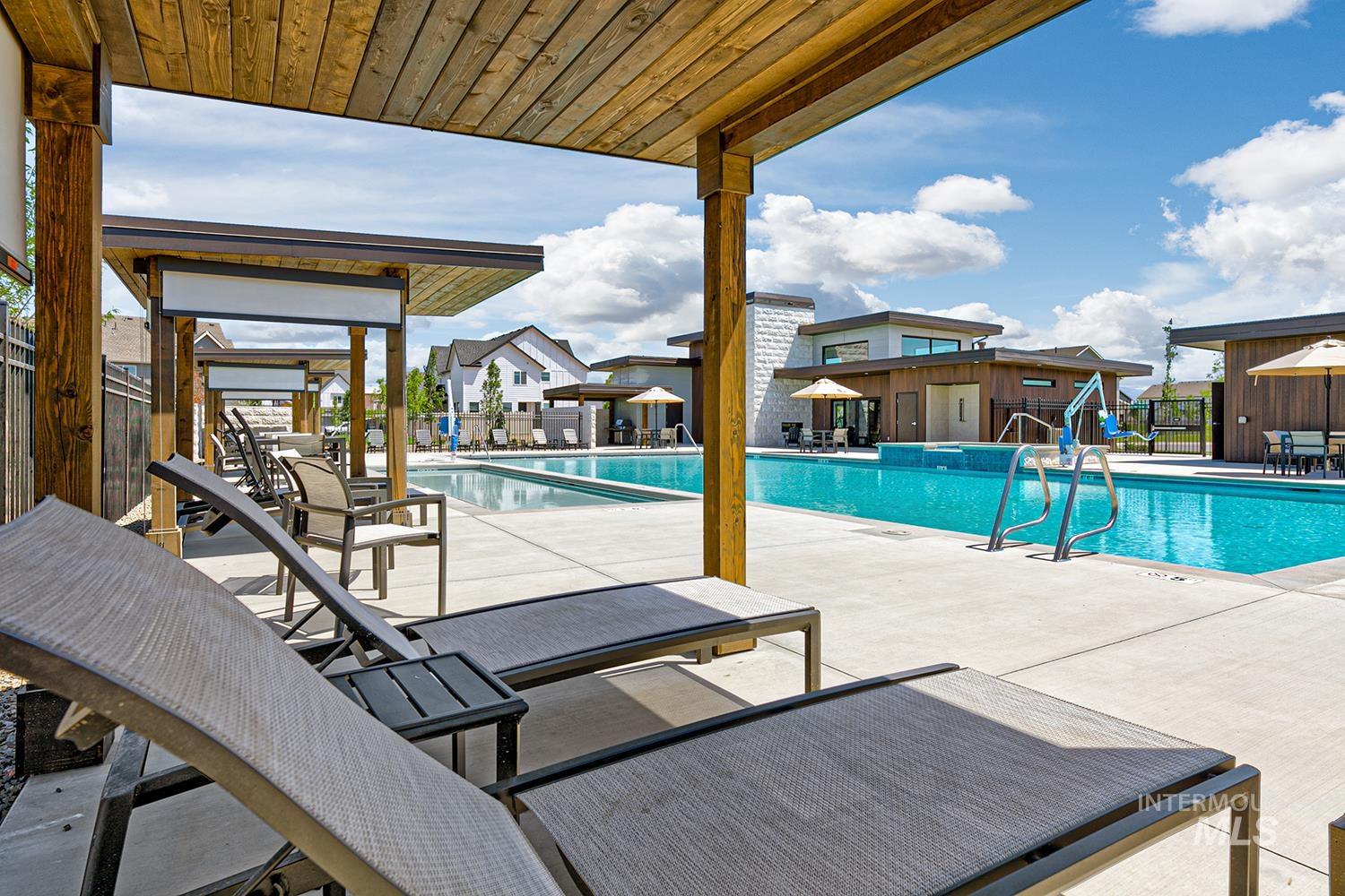 Community pool featuring a patio area