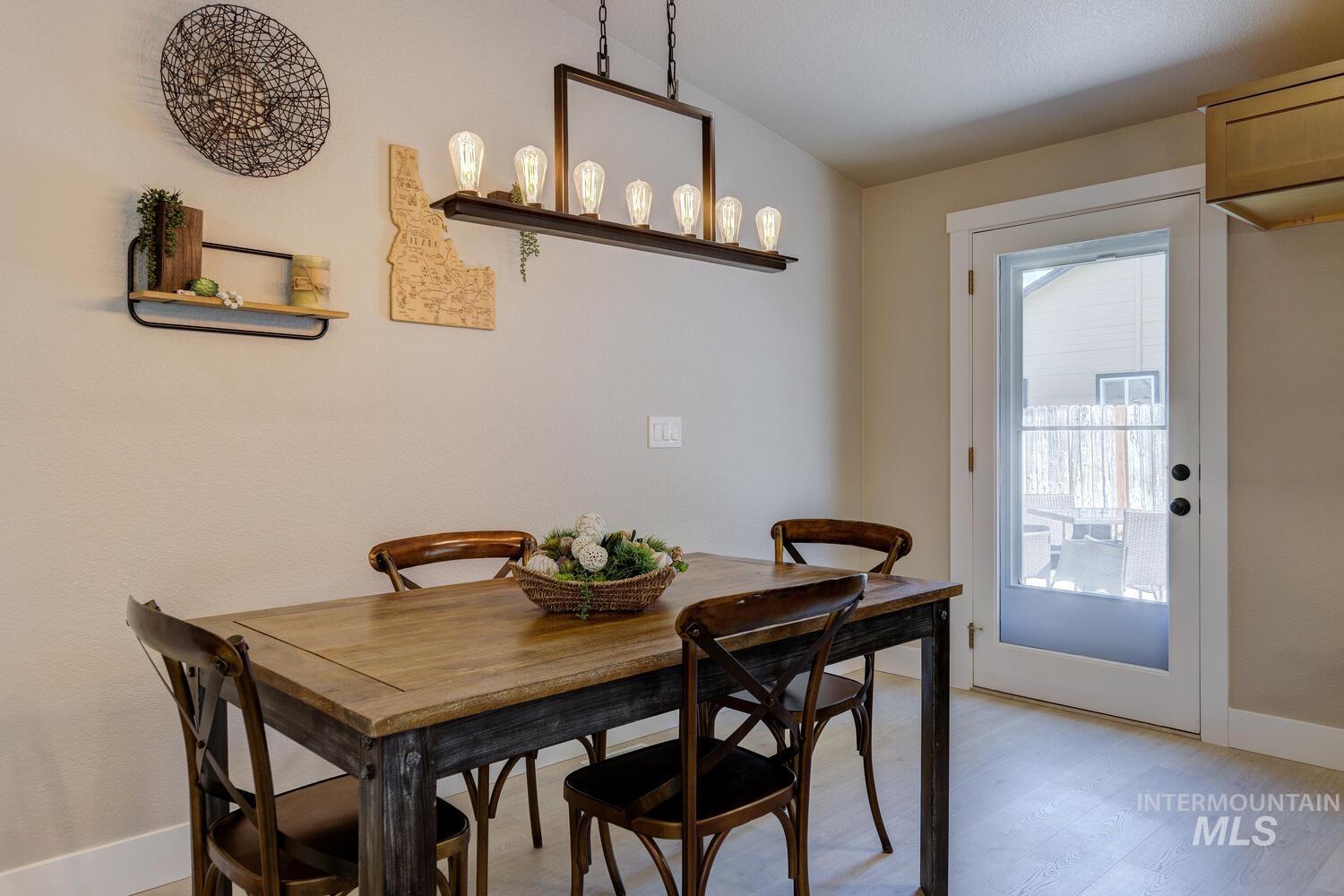 Dining room featuring baseboards and light wood-style flooring