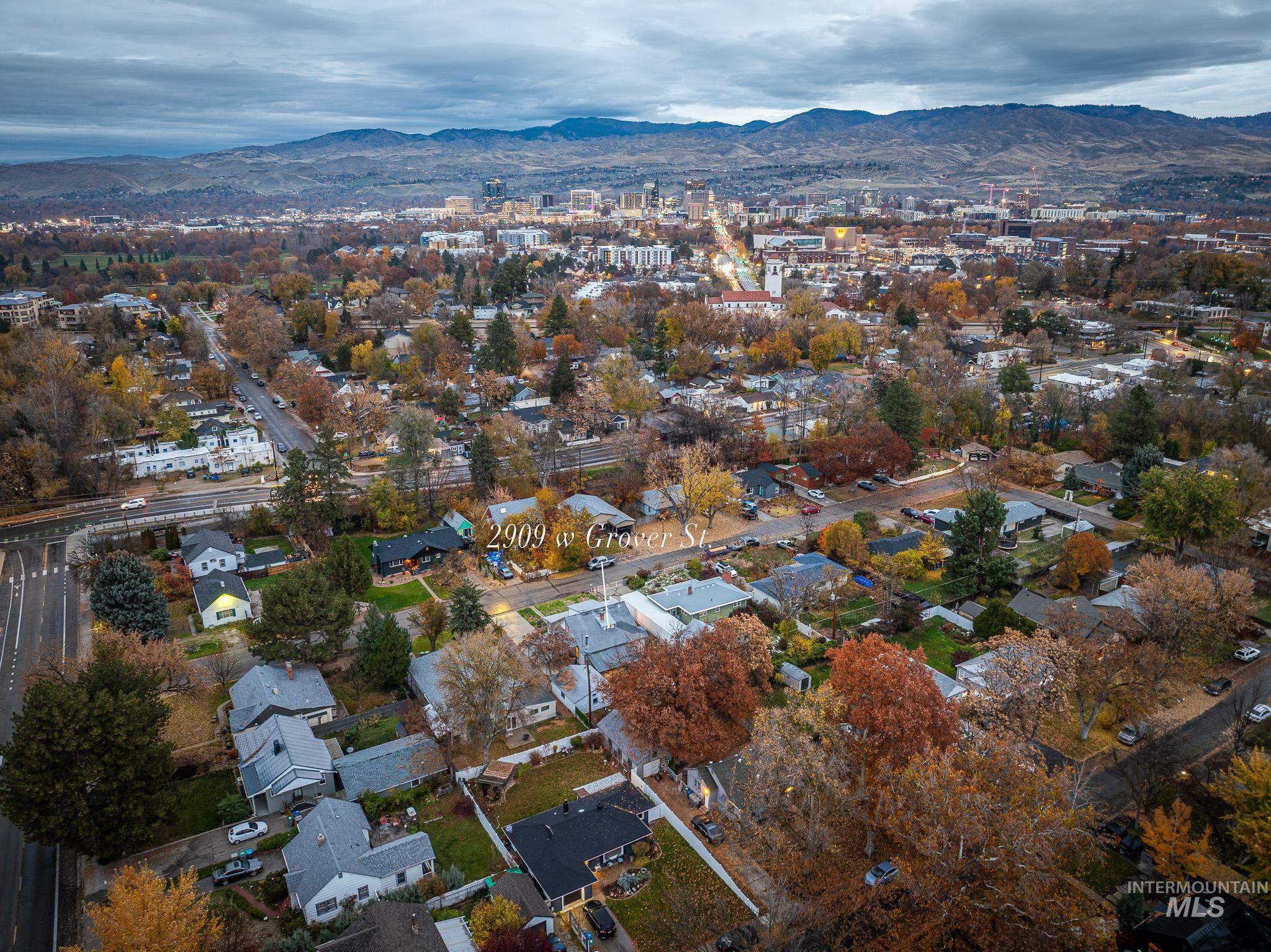 View of property location with a mountainous background and nearby suburban area