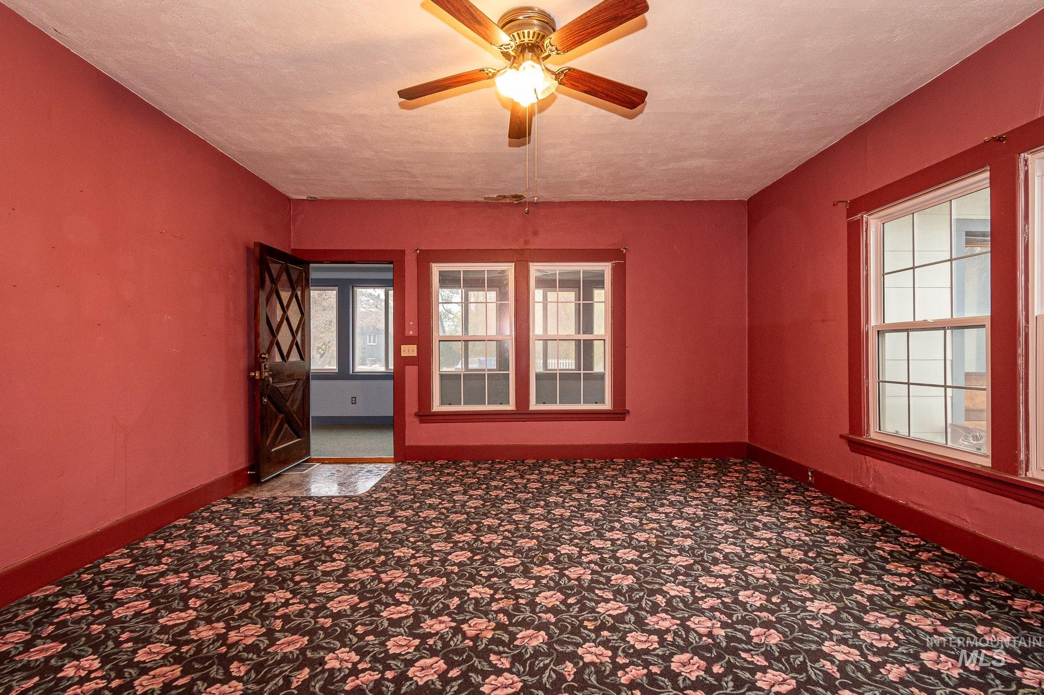 Unfurnished room featuring a textured ceiling and ceiling fan