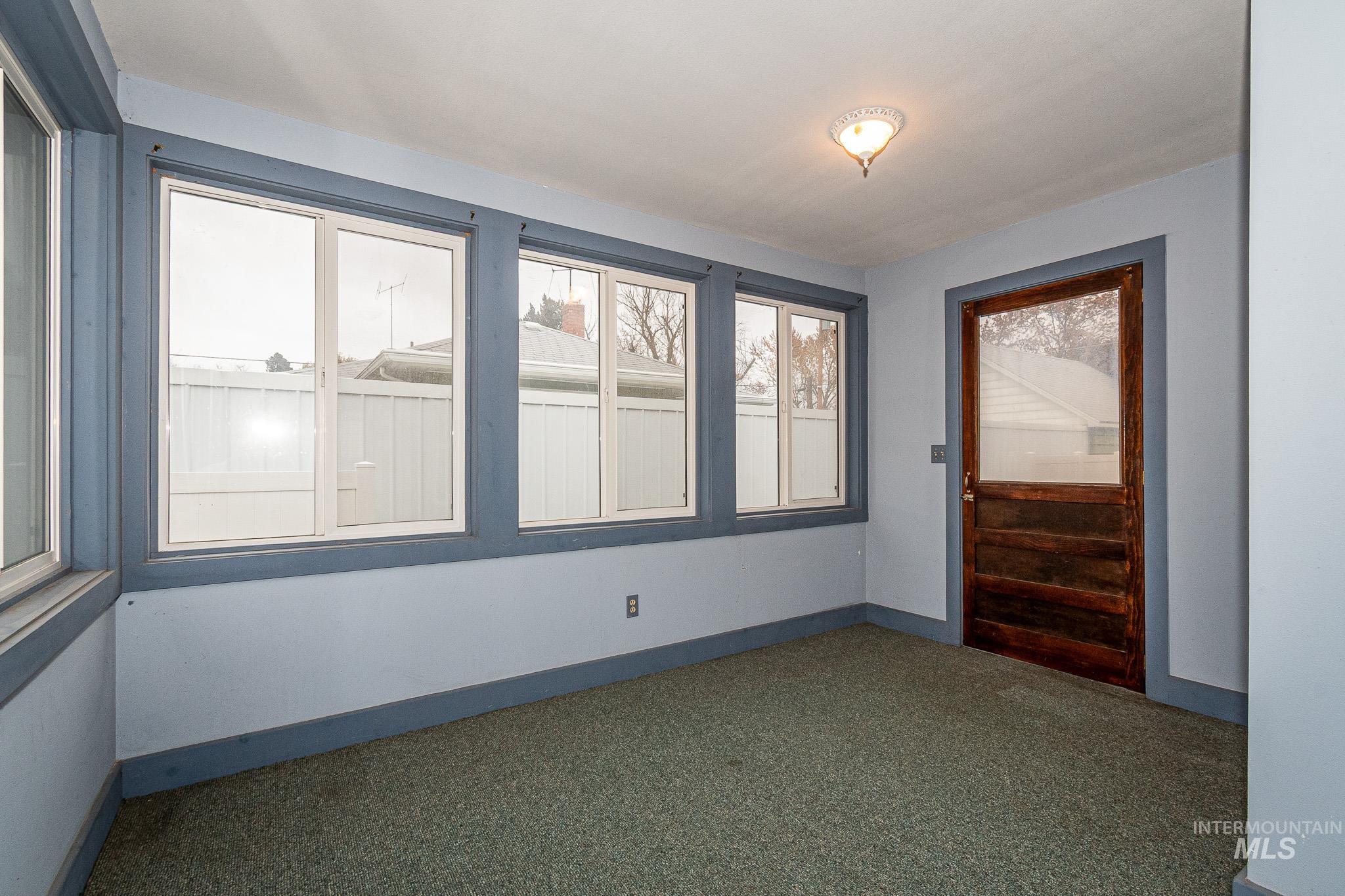 Unfurnished room featuring carpet