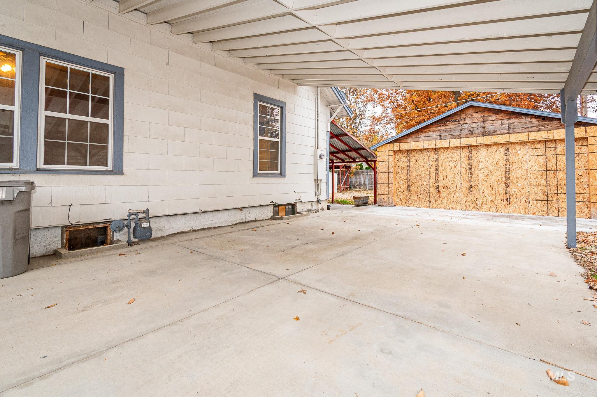 View of patio featuring a carport