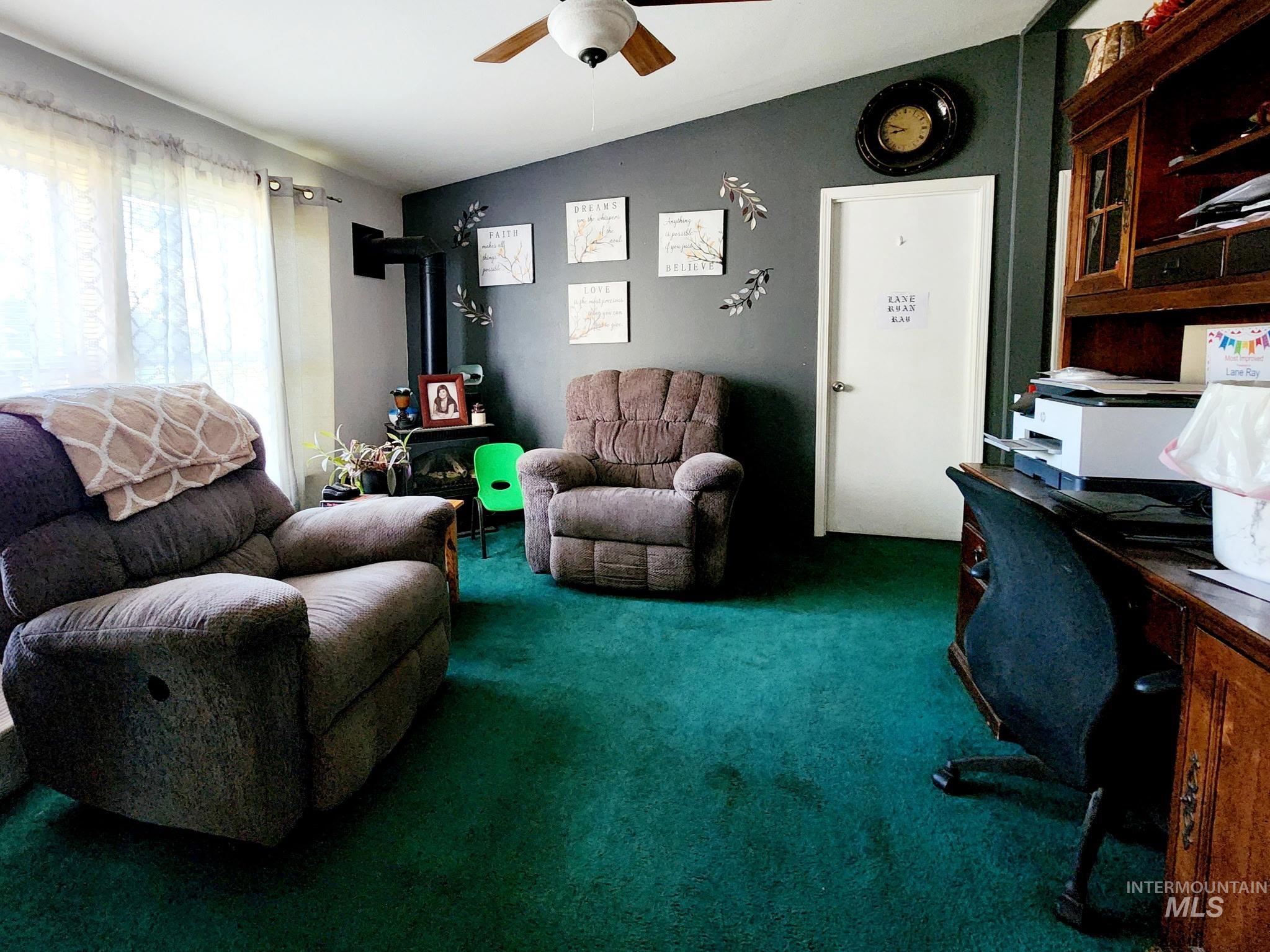 The den offers comfort and function with a propane fireplace, spacious layout, and versatile design ideal for a home office or reading nook.