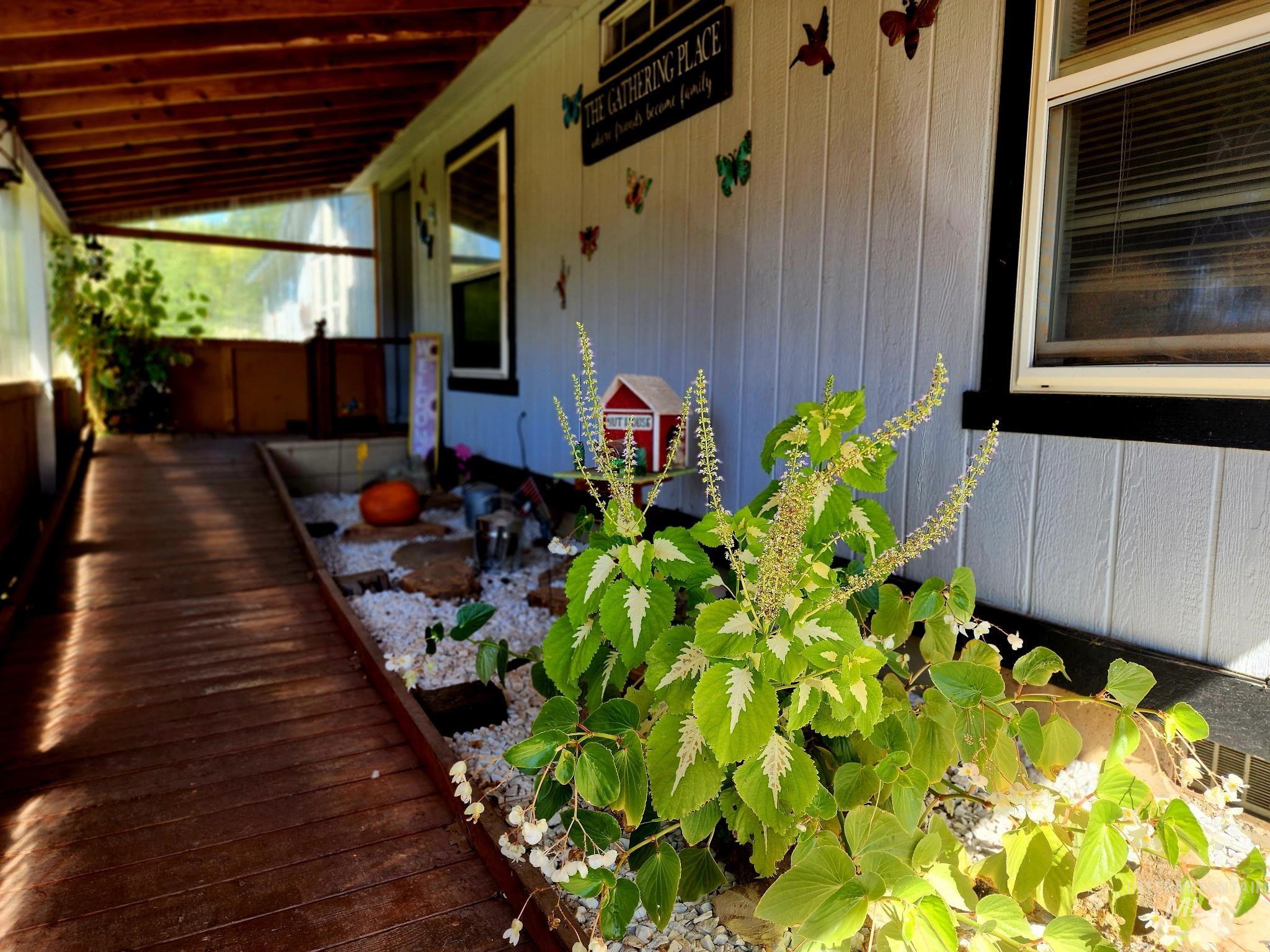 The covered entryway with a wheelchair ramp ensures this home is both welcoming and practical for all lifestyles.
