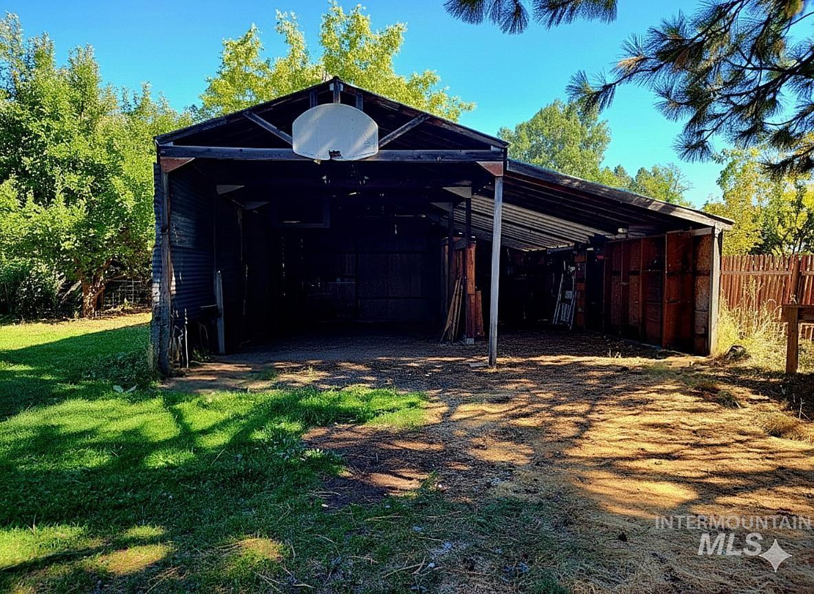 A spacious outbuilding provides versatile use as a workshop, equipment storage, or hobby space, with plenty of room to expand.