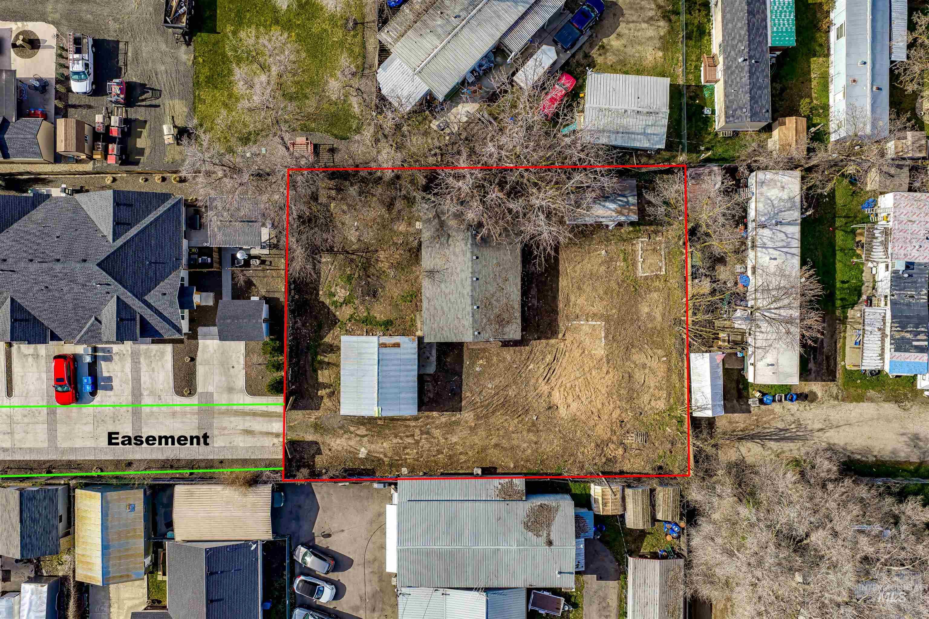 Aerial view of residential area featuring property boundaries highlighted