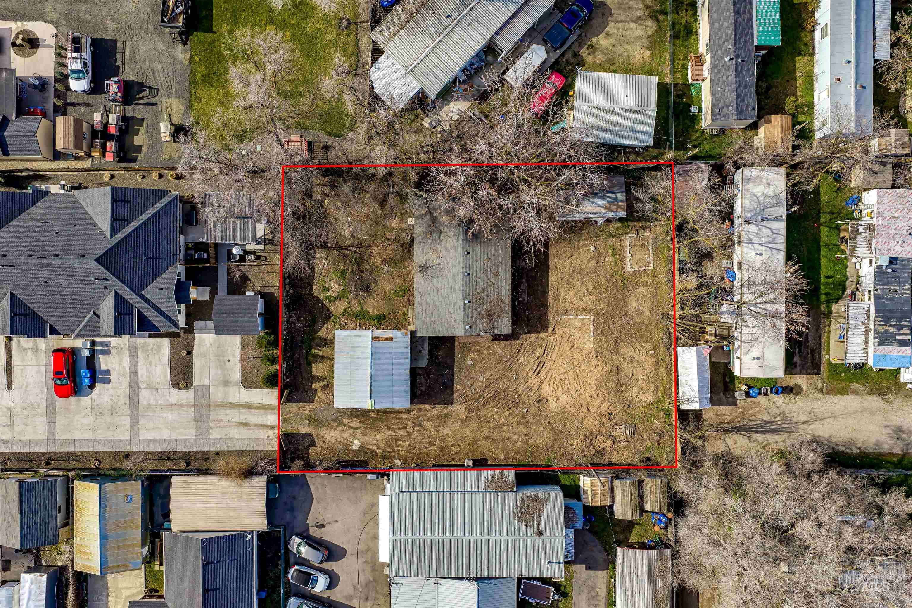 Aerial view of residential area with property parcel outlined