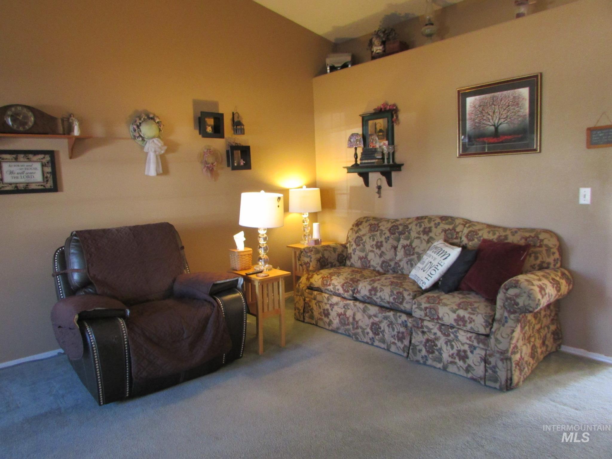 Neutral wall tones complement carpeted flooring