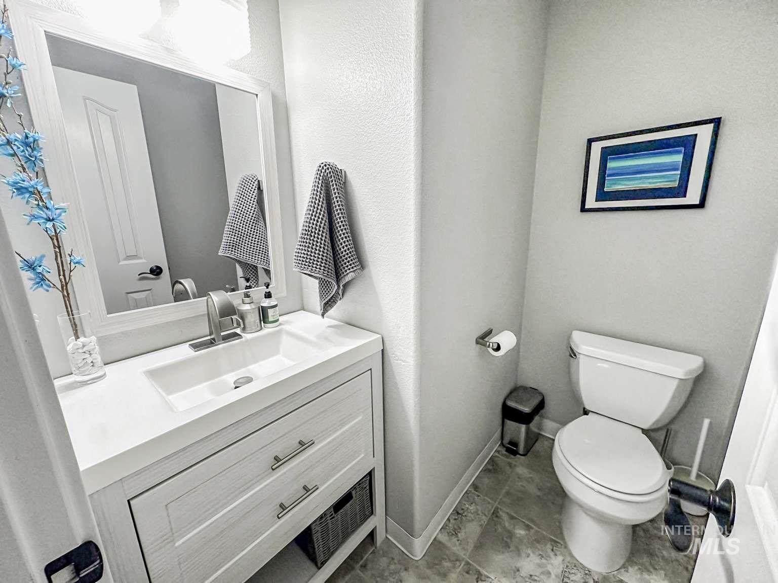 Bathroom featuring vanity and light tile patterned floors