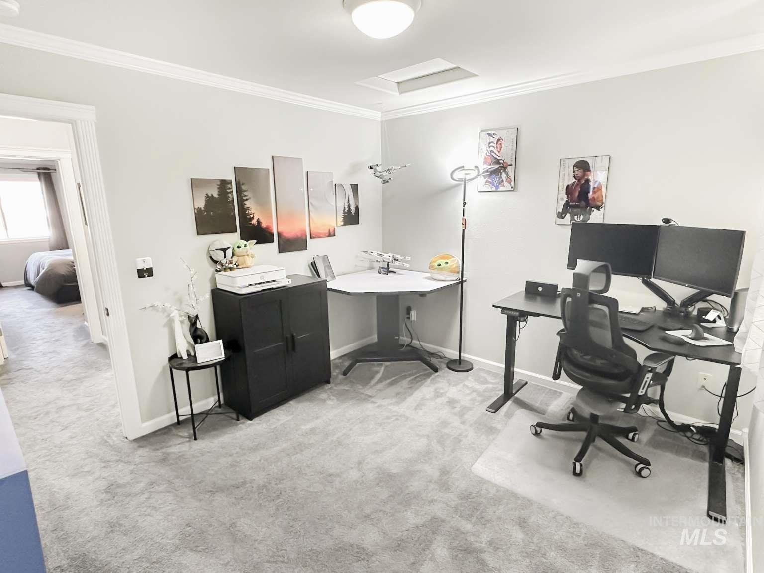 Office featuring light carpet, crown molding, and attic access