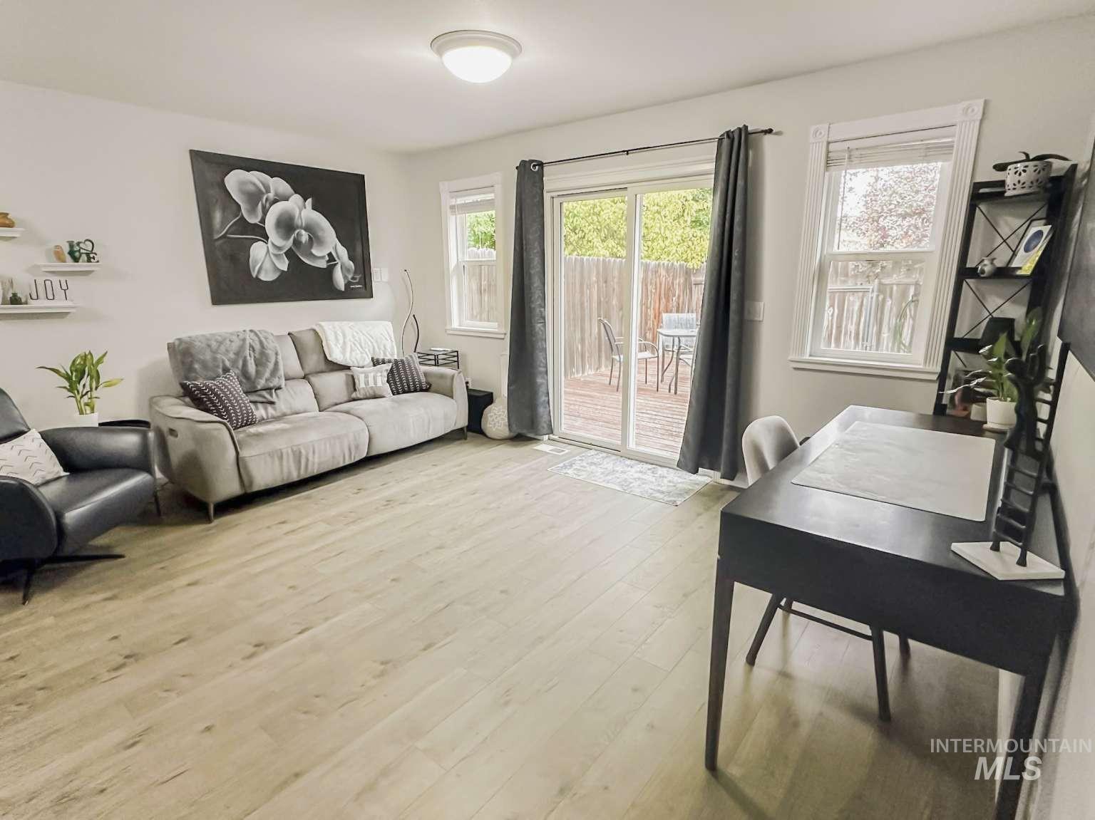 Living room featuring light wood-style floors