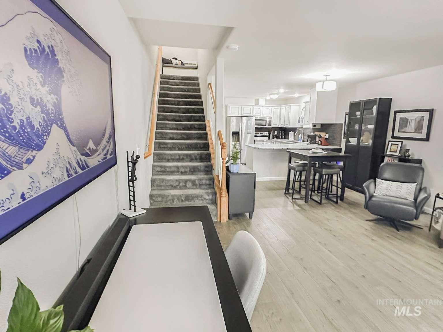Staircase featuring wood-type flooring