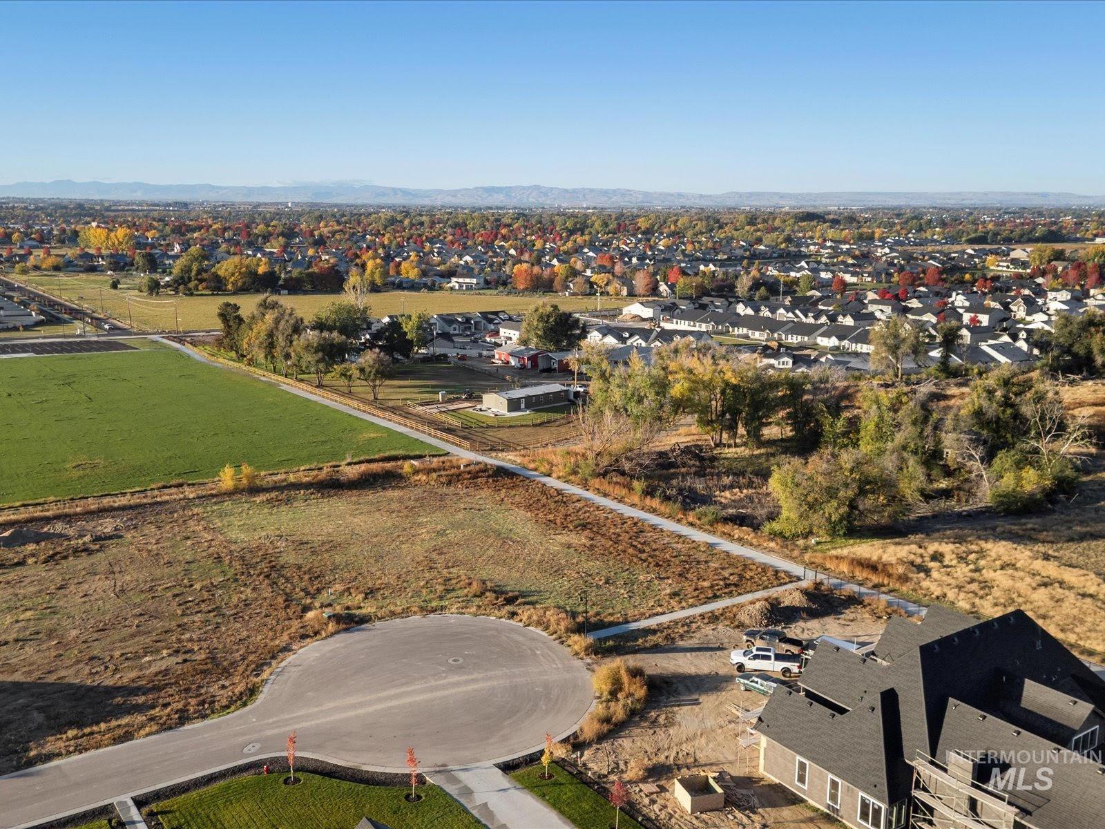 Aerial overview of property's location with nearby suburban area