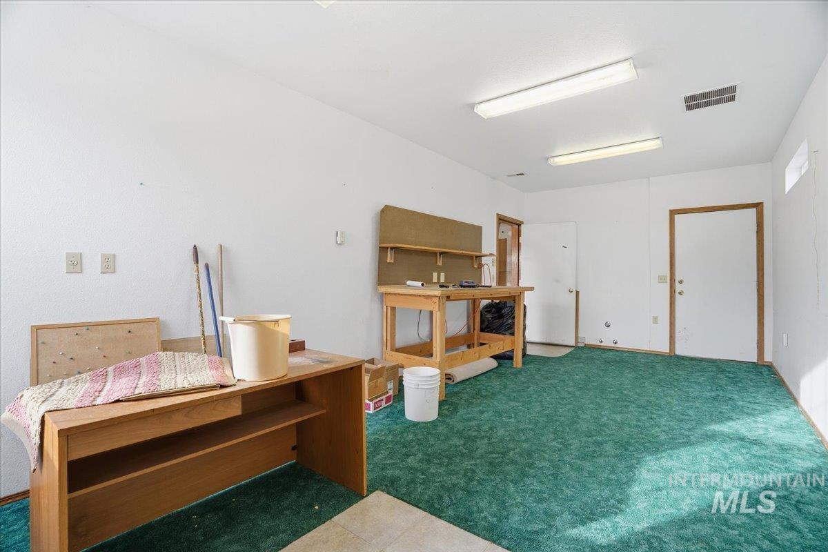 Miscellaneous room featuring carpet floors