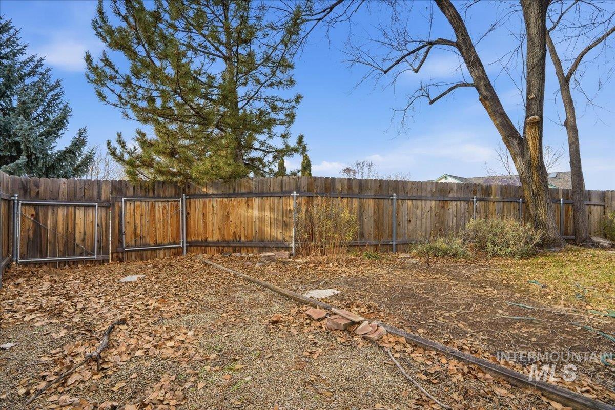 View of fenced backyard
