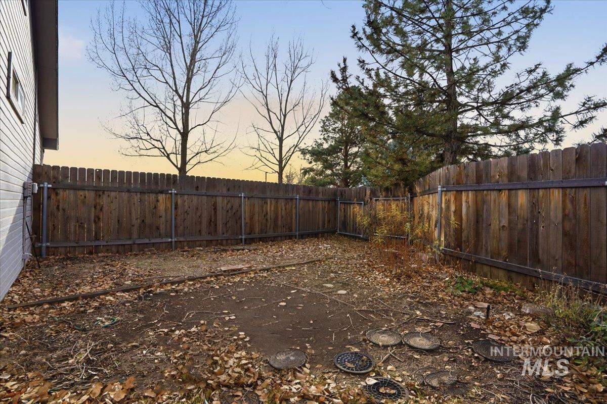 View of fenced backyard