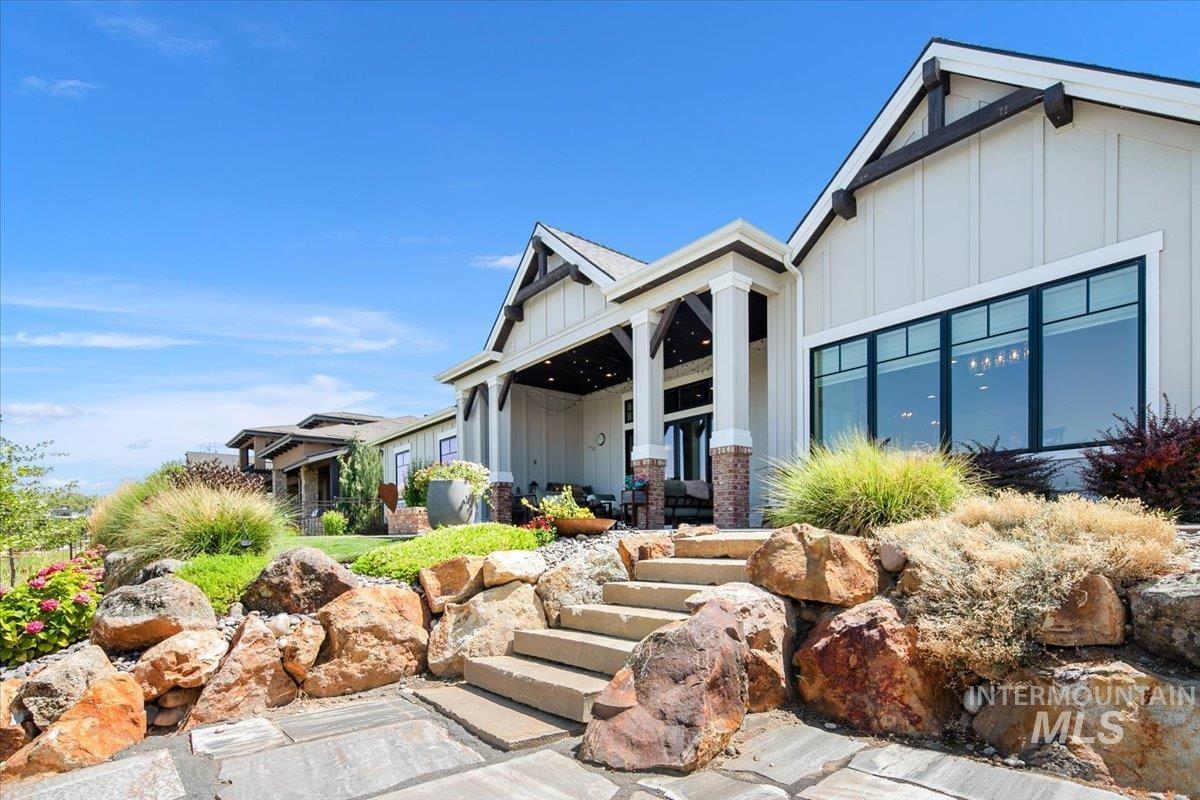 View of front of home featuring board and batten siding and covered porch
