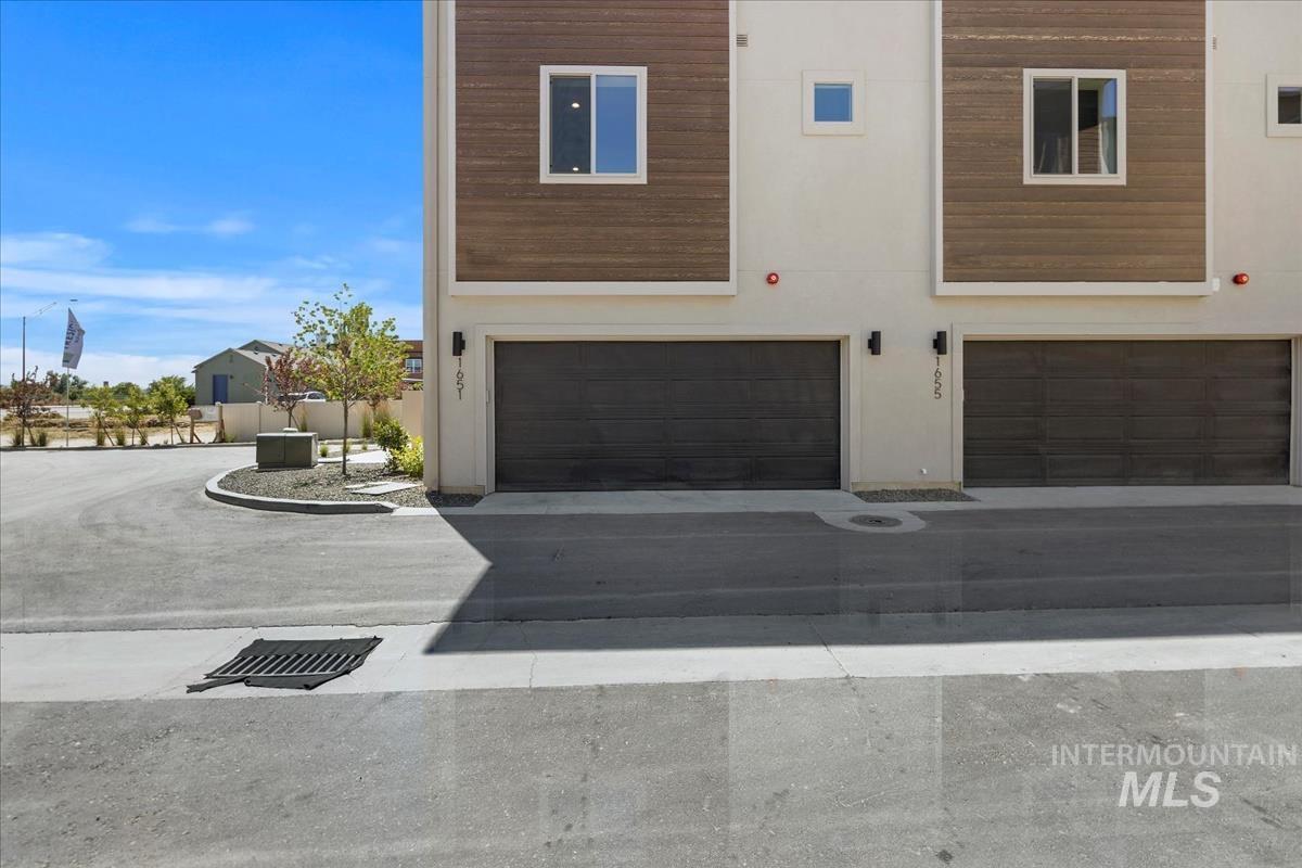 View of front facade featuring an attached garage