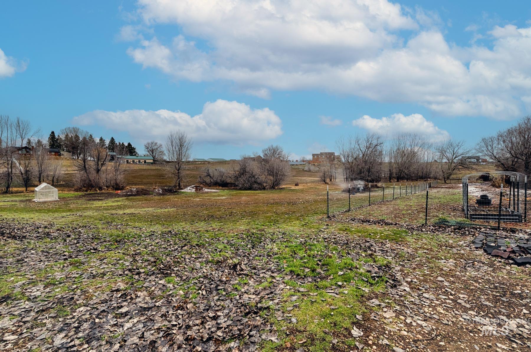 View of yard with a rural view