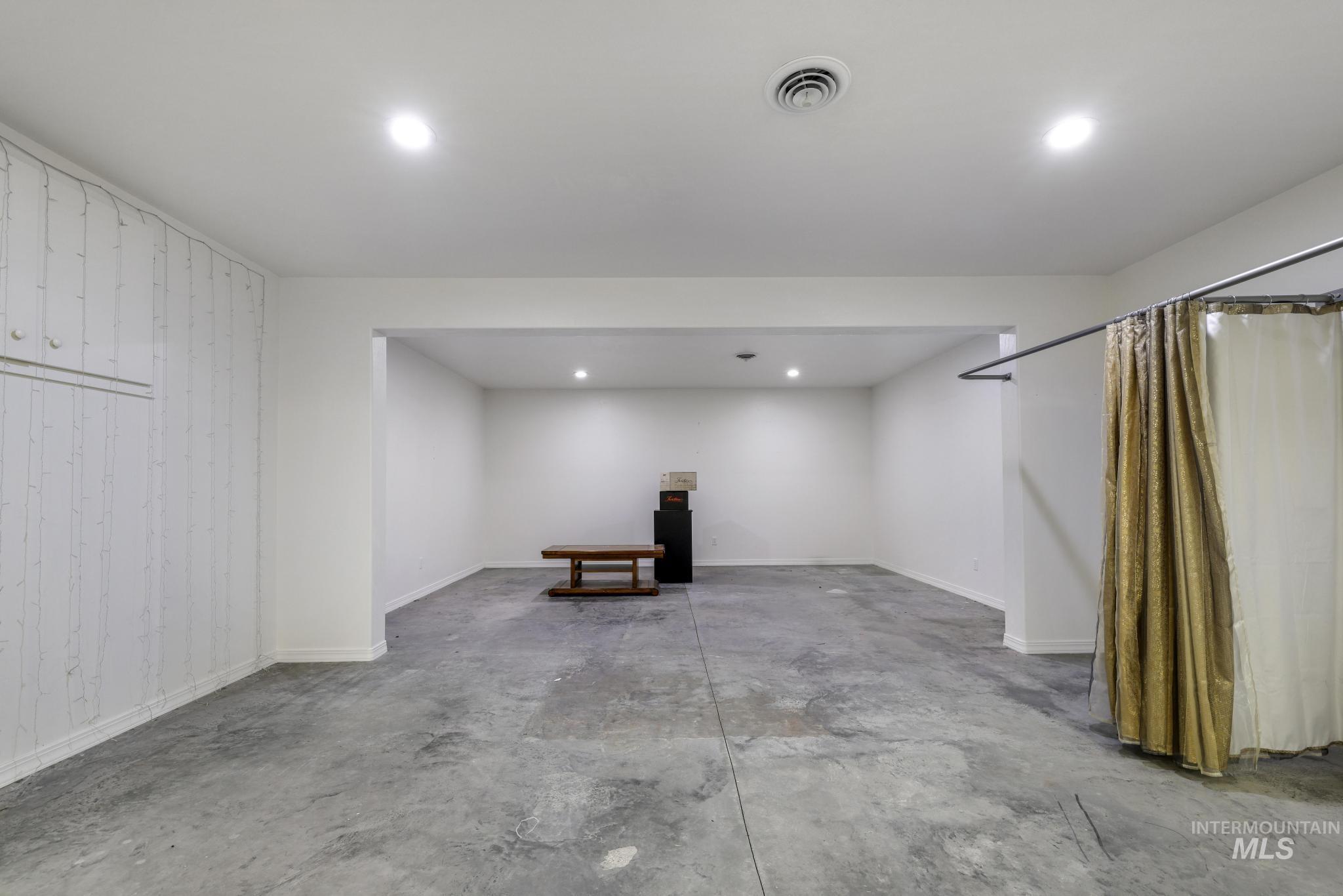 Basement featuring recessed lighting