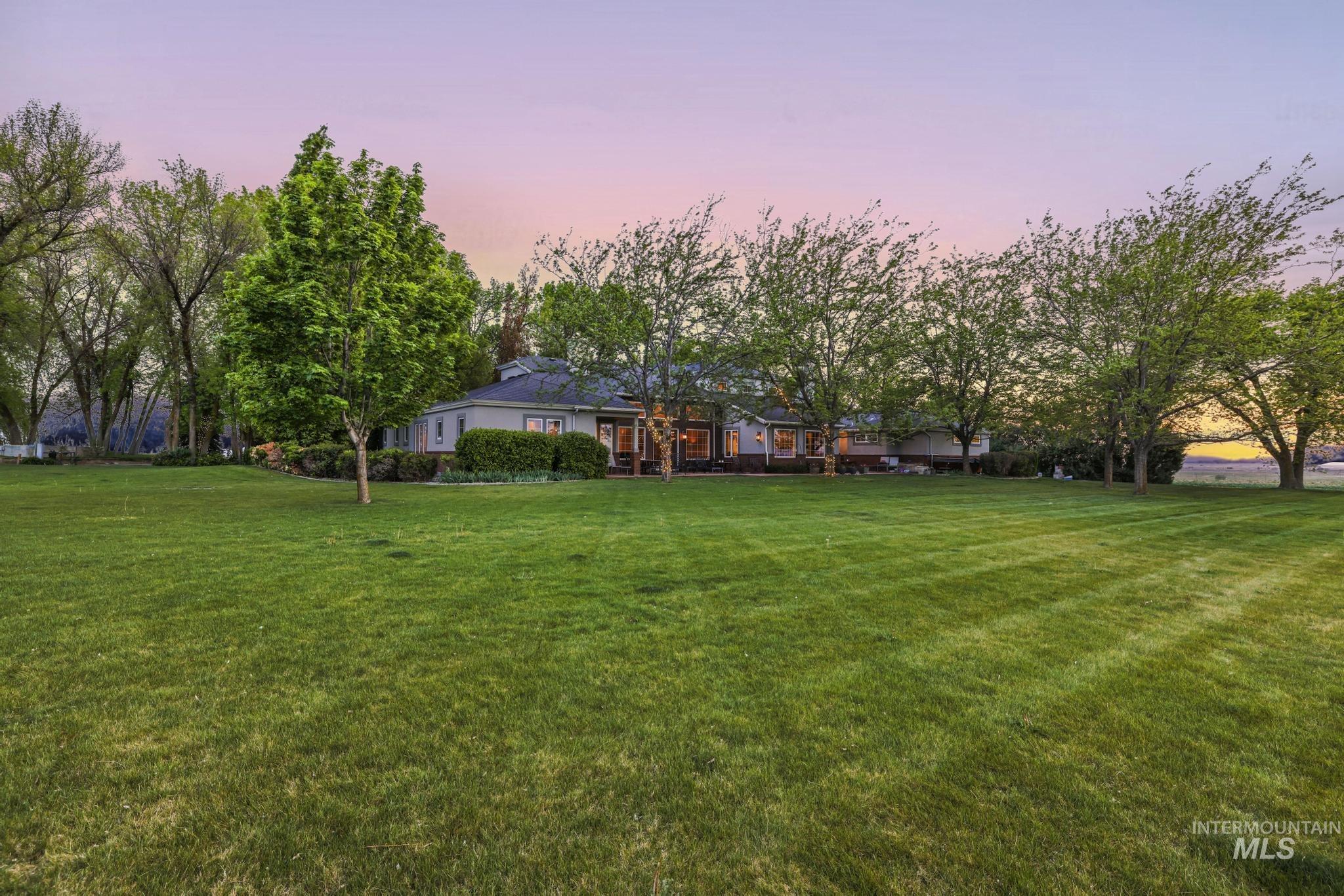 Yard at dusk featuring a yard