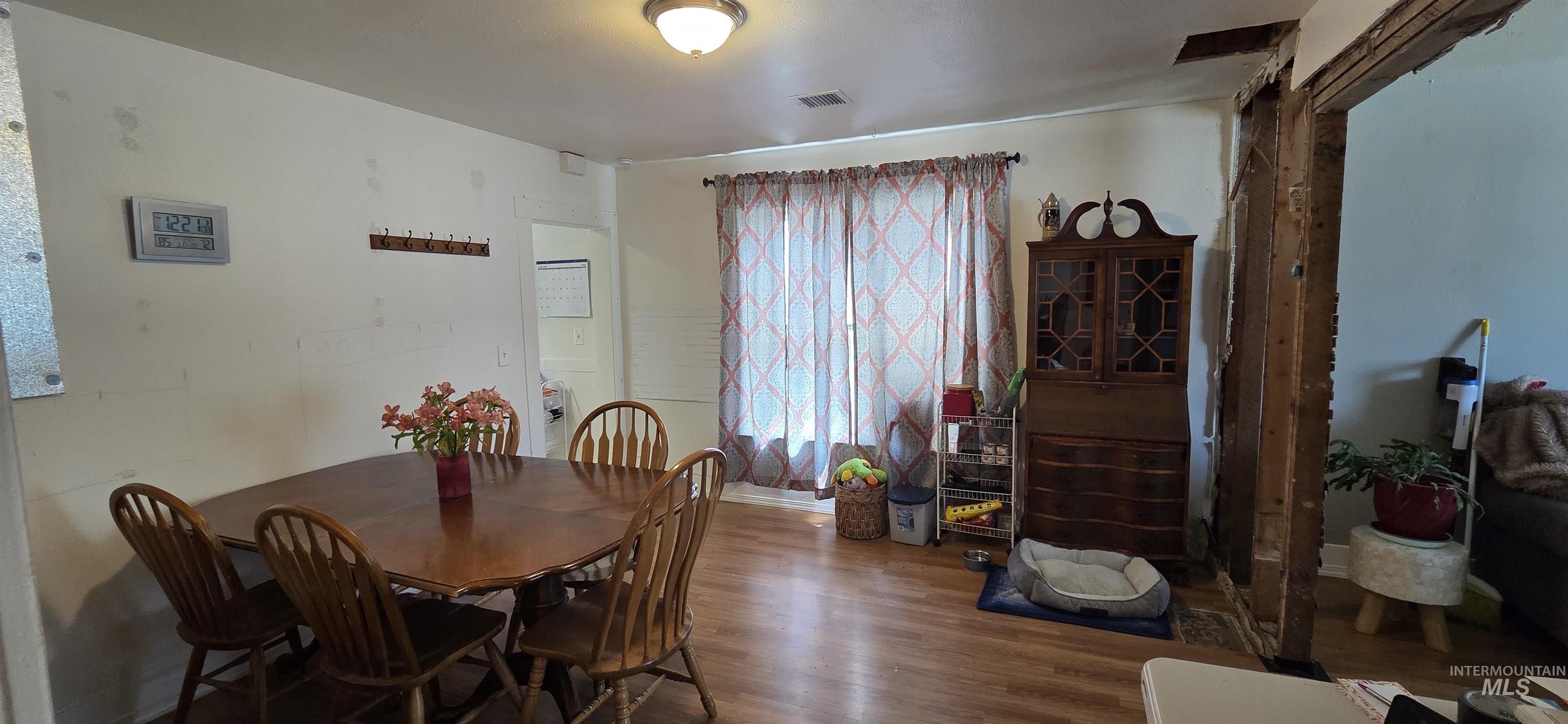Dining room featuring wood finished floors