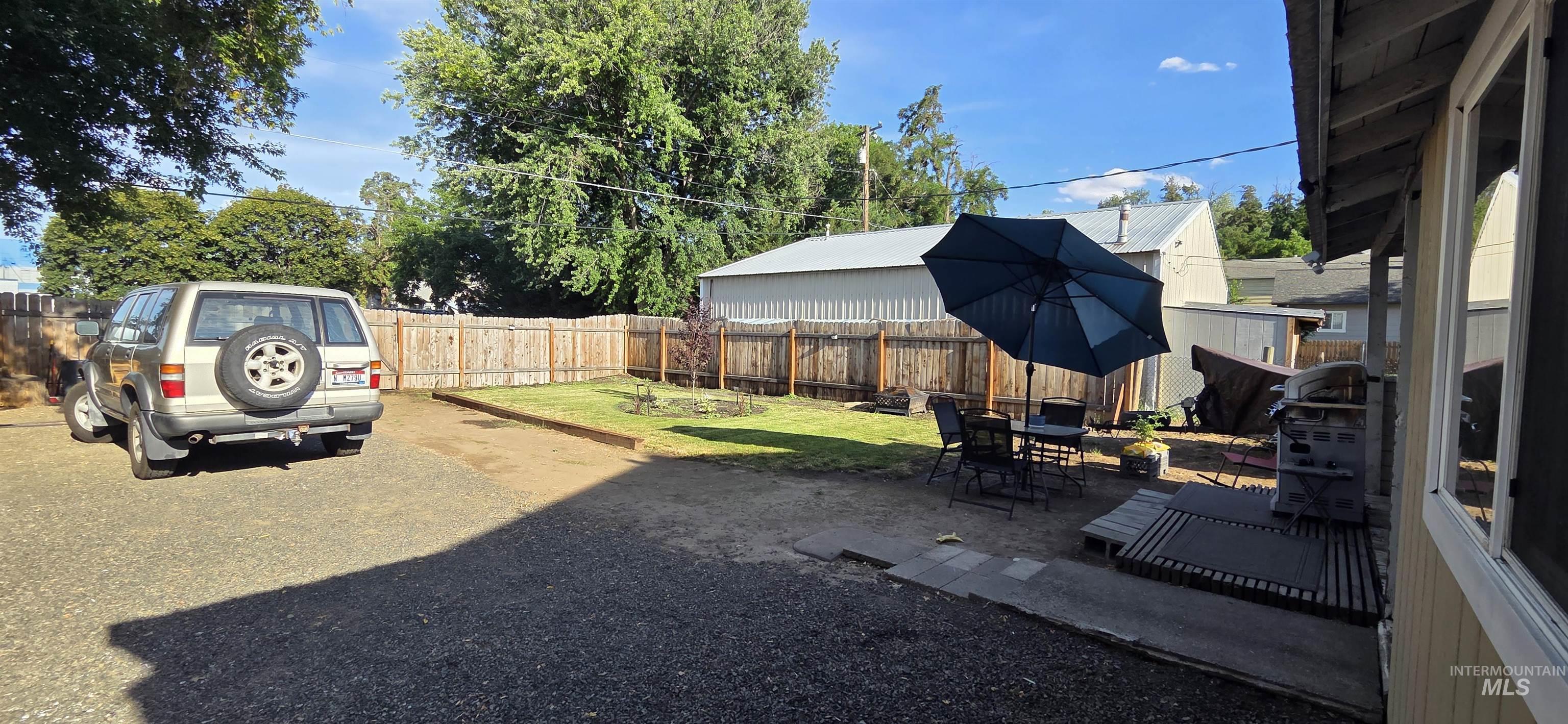 Fenced backyard featuring a patio area