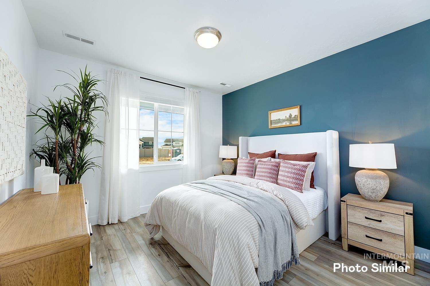 Bedroom with light wood-style floors