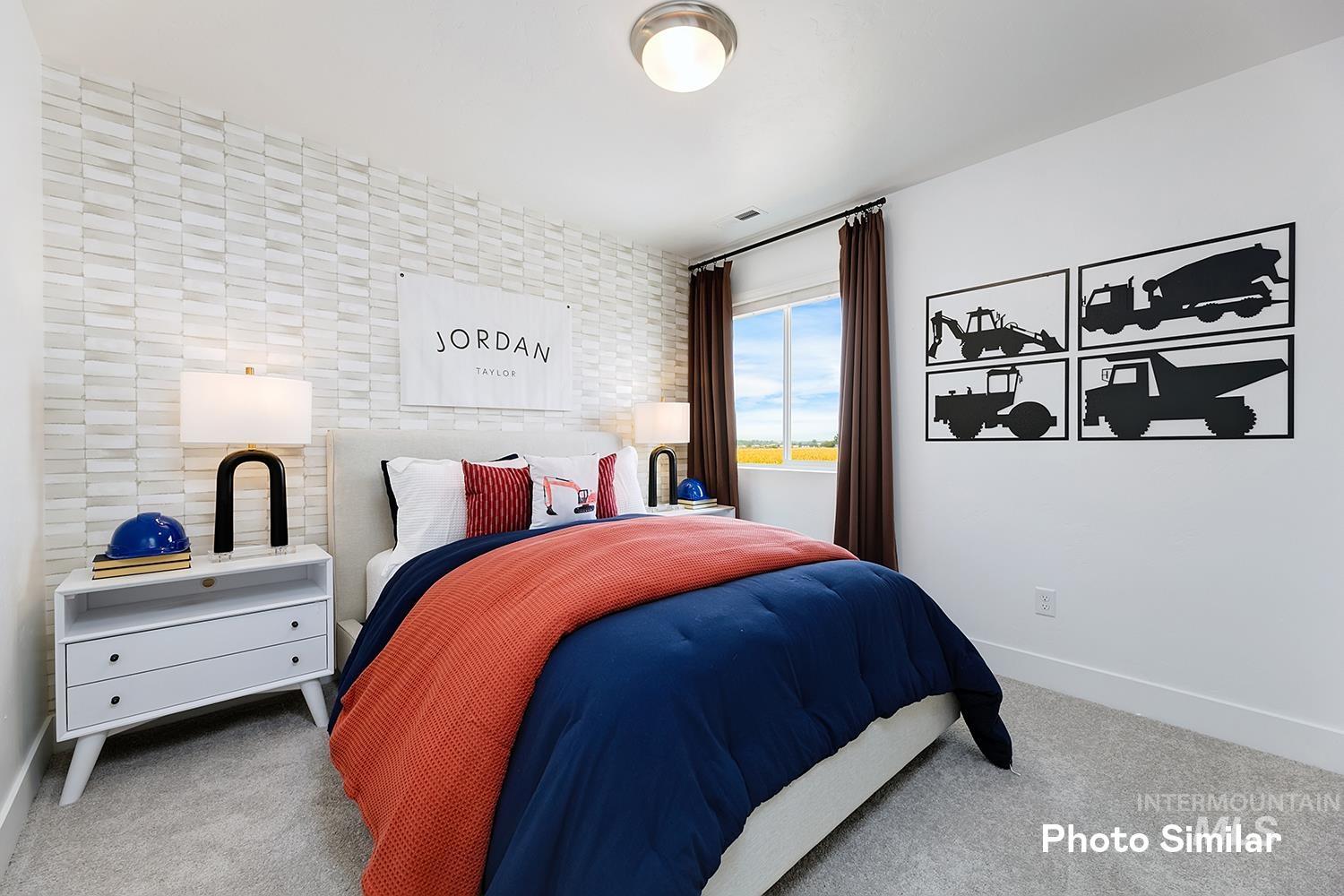Bedroom featuring baseboards and carpet floors