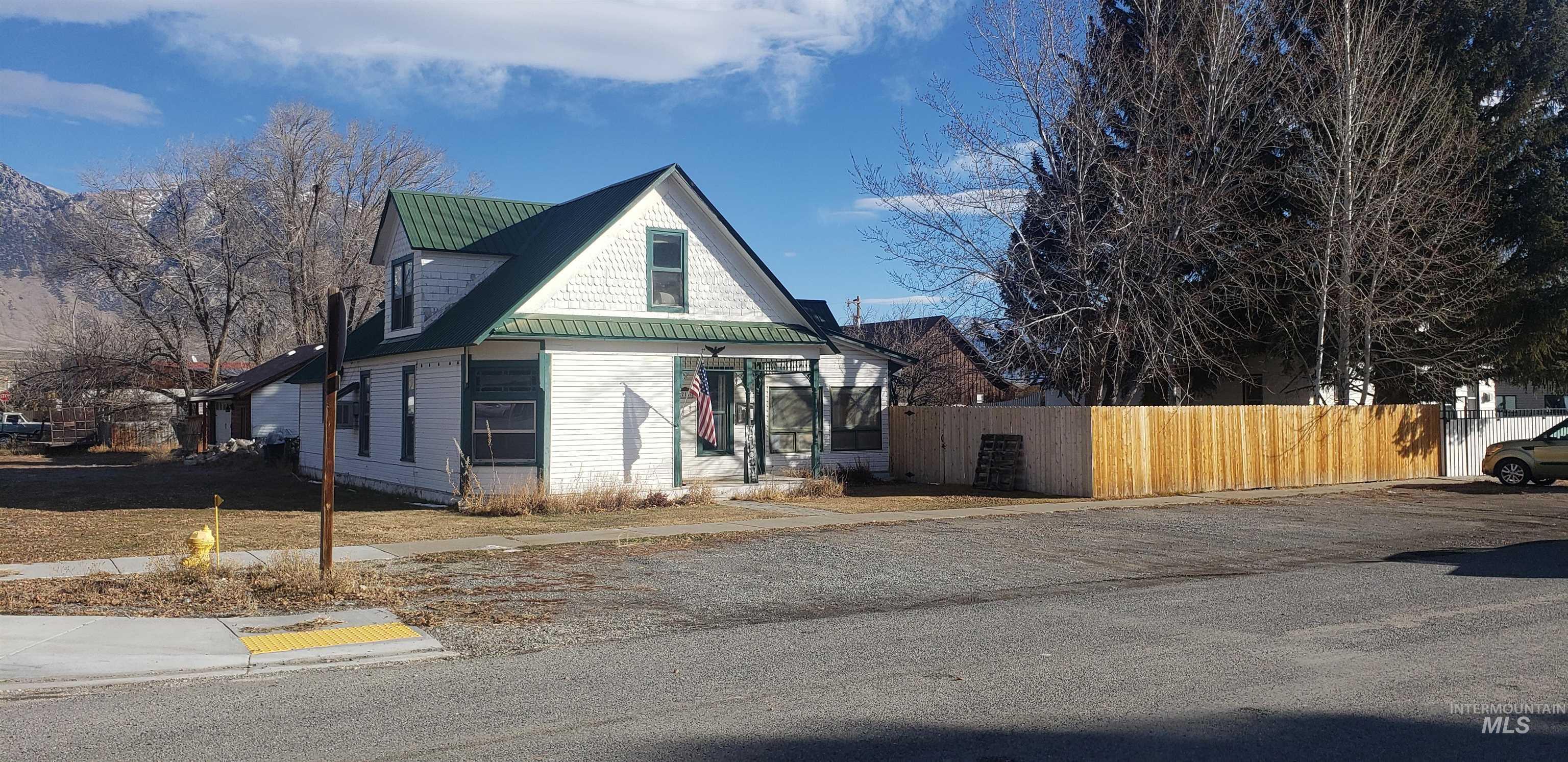 View of property exterior featuring a metal roof