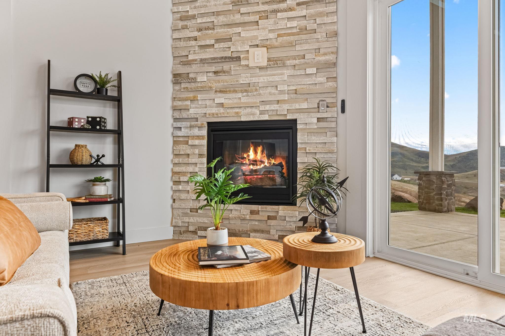 Living area featuring wood finished floors and a fireplace