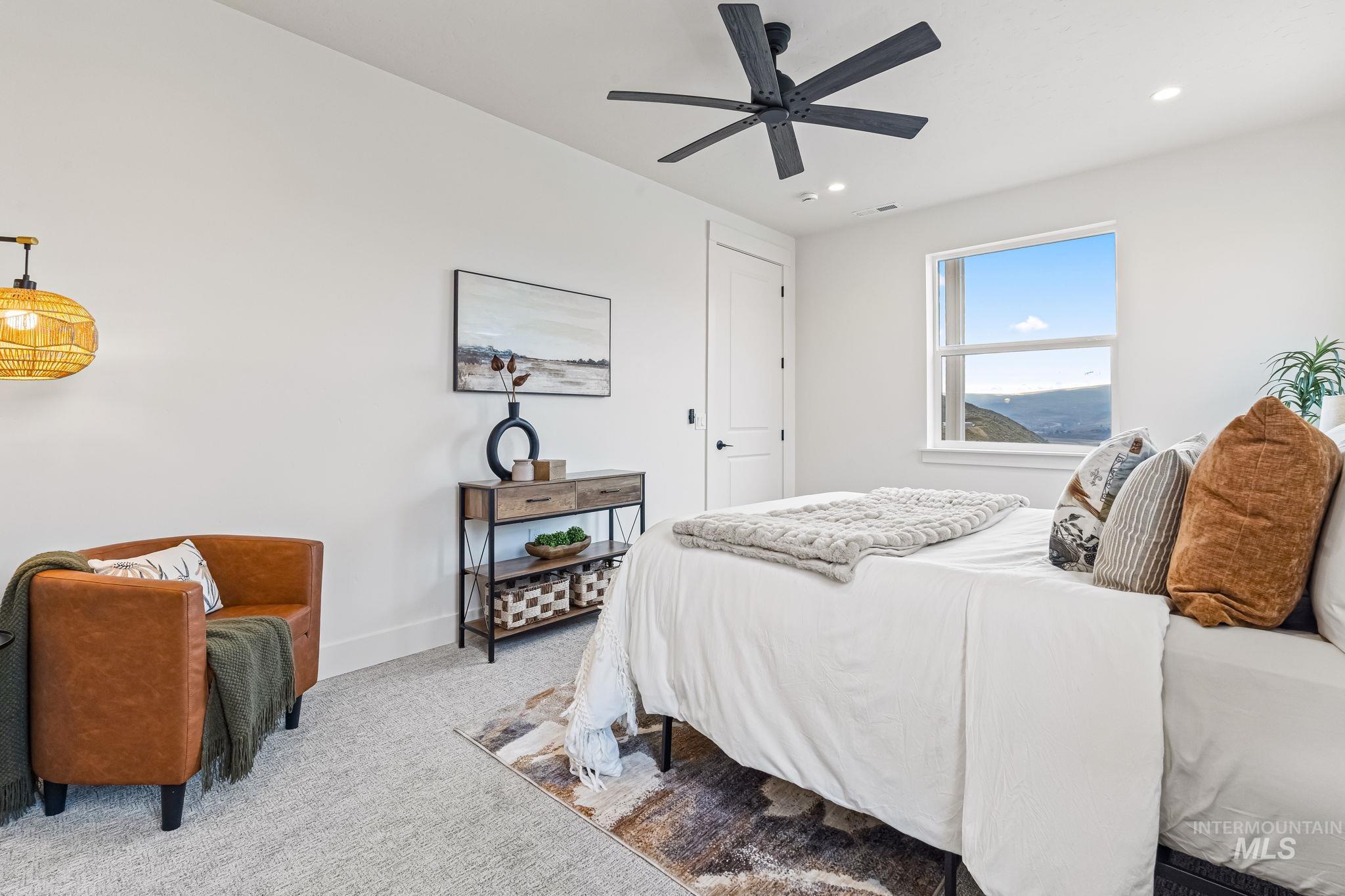 Bedroom with carpet flooring, a ceiling fan, and recessed lighting