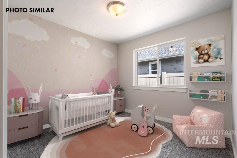 Spacious interior room featuring a large window, textured wall finishes, permanent wall mural detailing, built-in wall shelving, and a flush-mount ceiling light fixture