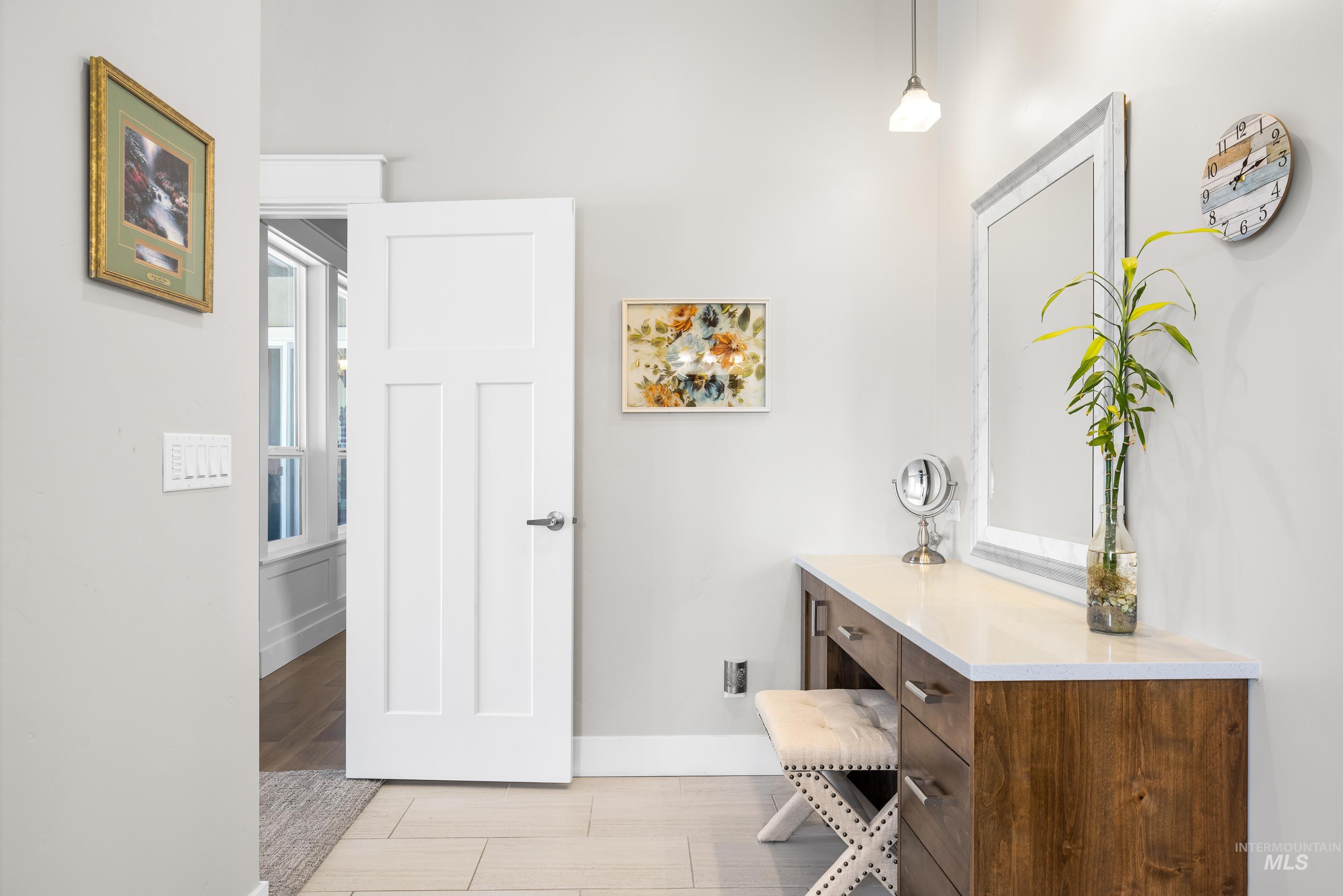 Bathroom featuring baseboards and vanity