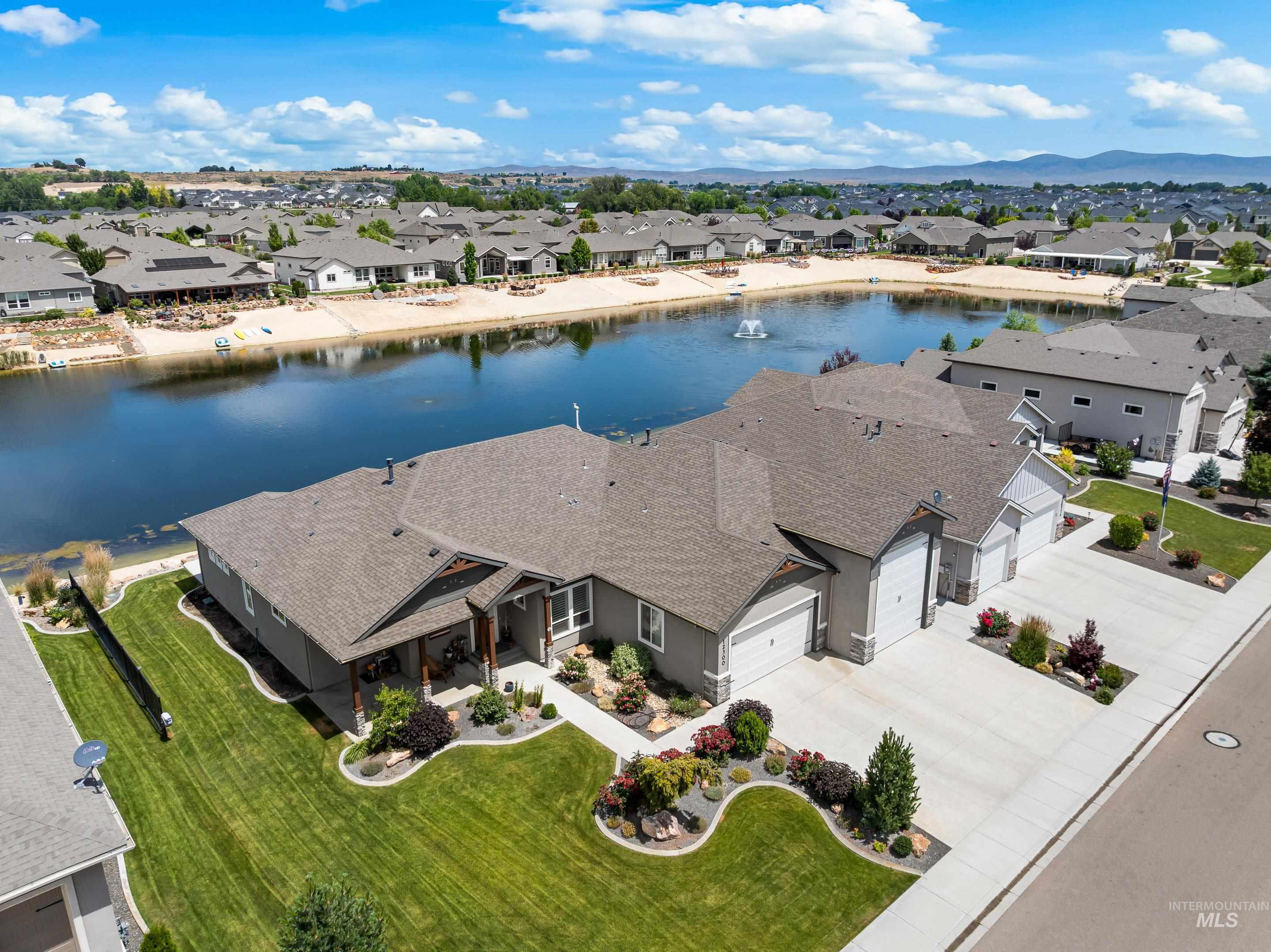 Aerial perspective of suburban area with a nearby body of water