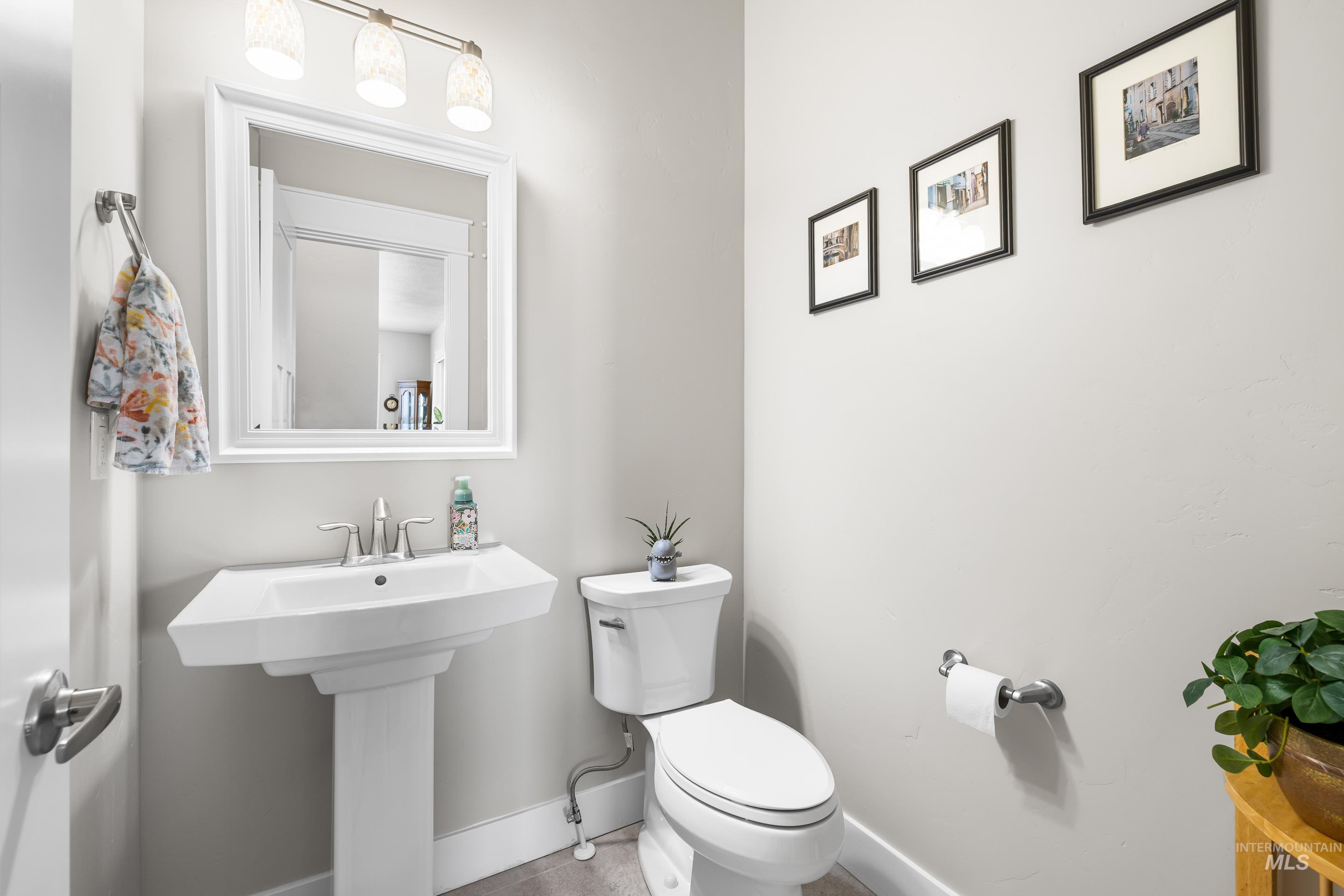 Bathroom featuring toilet and baseboards