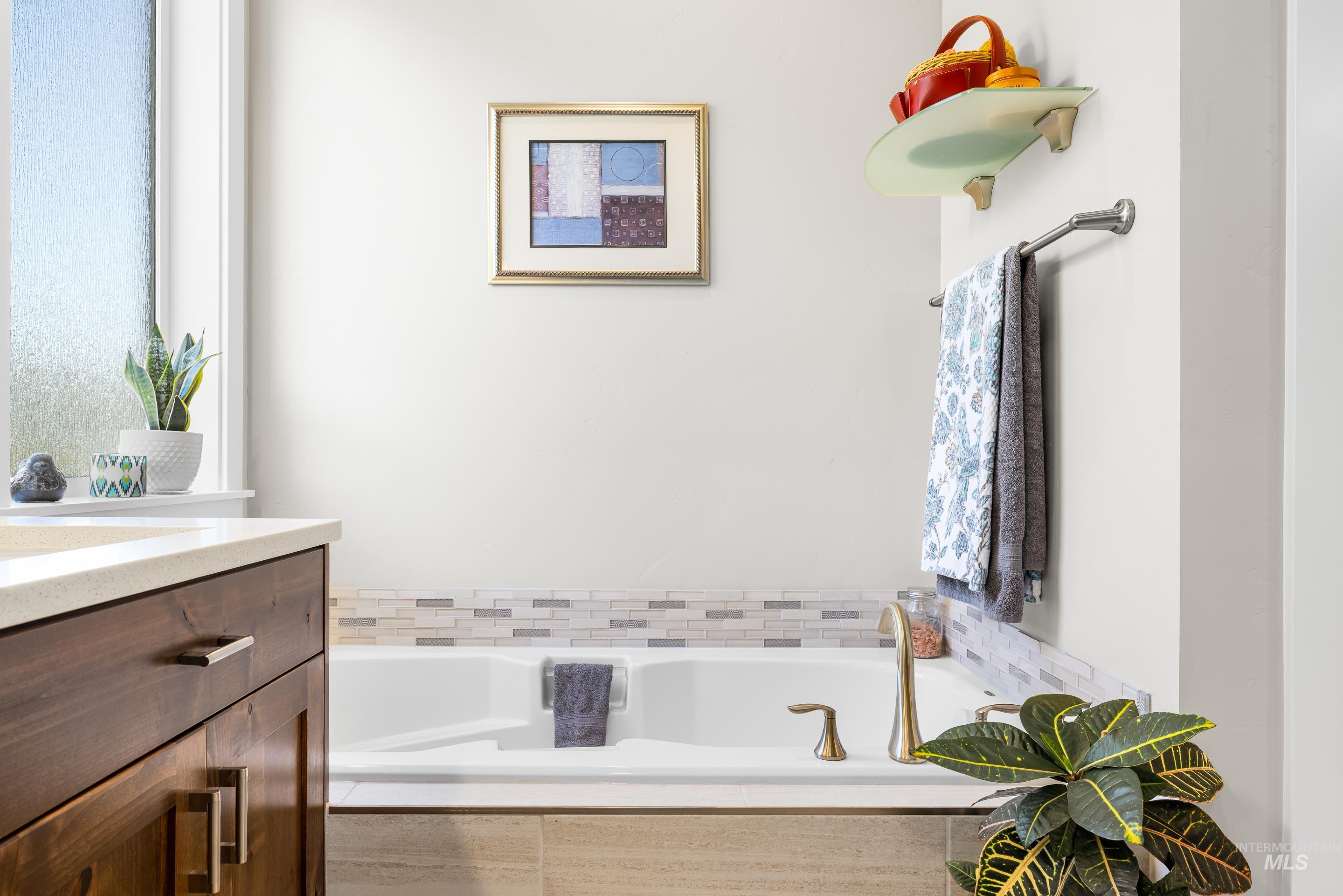 Bathroom with vanity and a garden tub