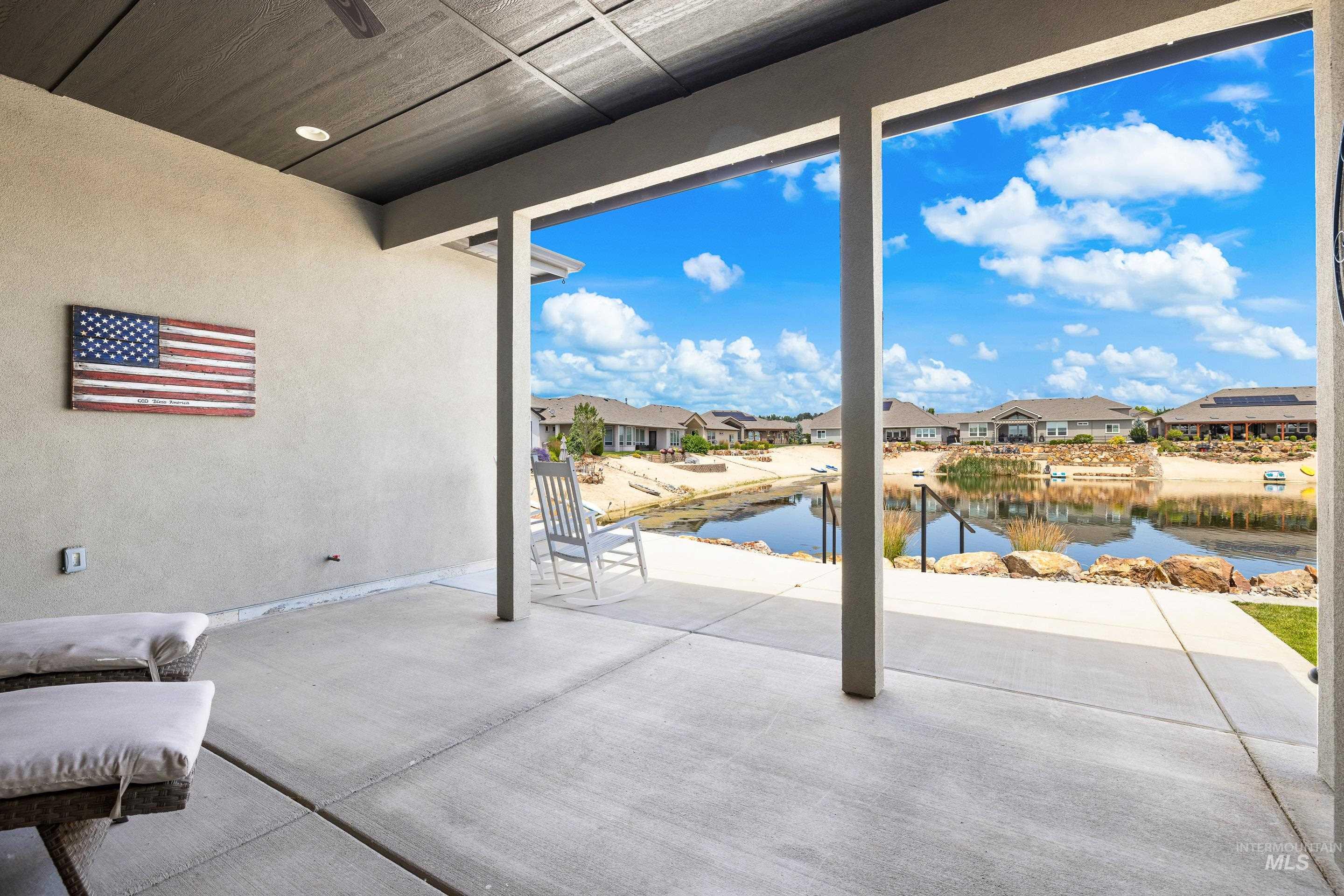 View of patio / terrace featuring a water view and a residential view