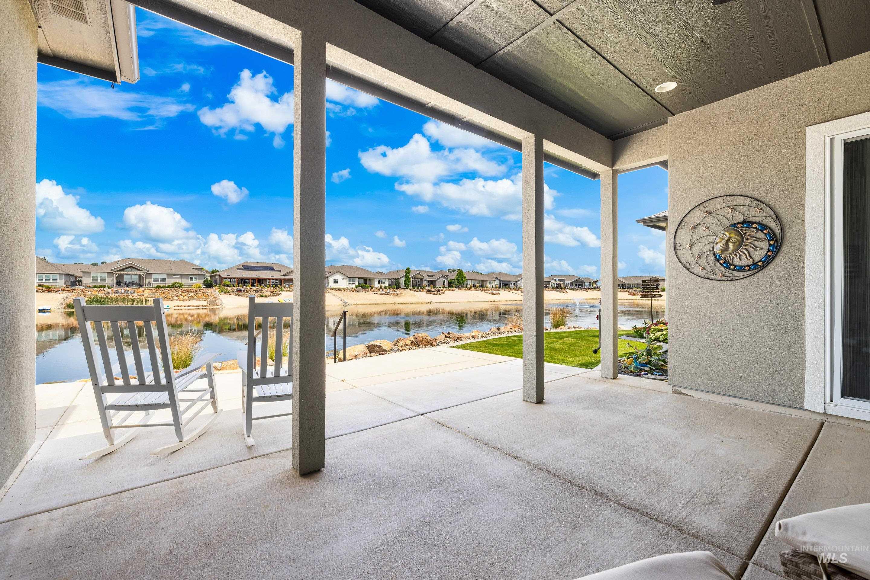View of patio featuring a water view and a residential view