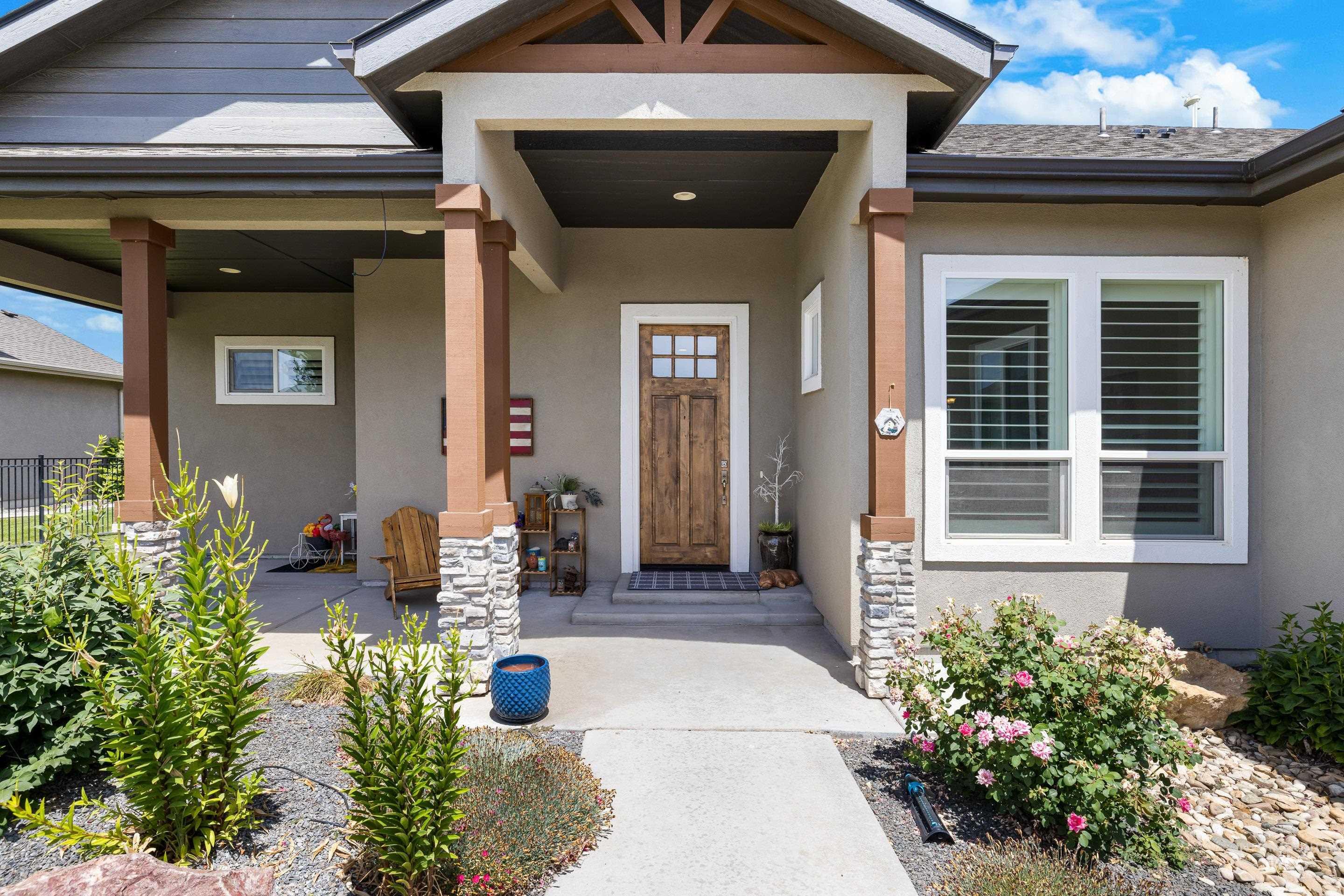 Entrance to property with stucco siding