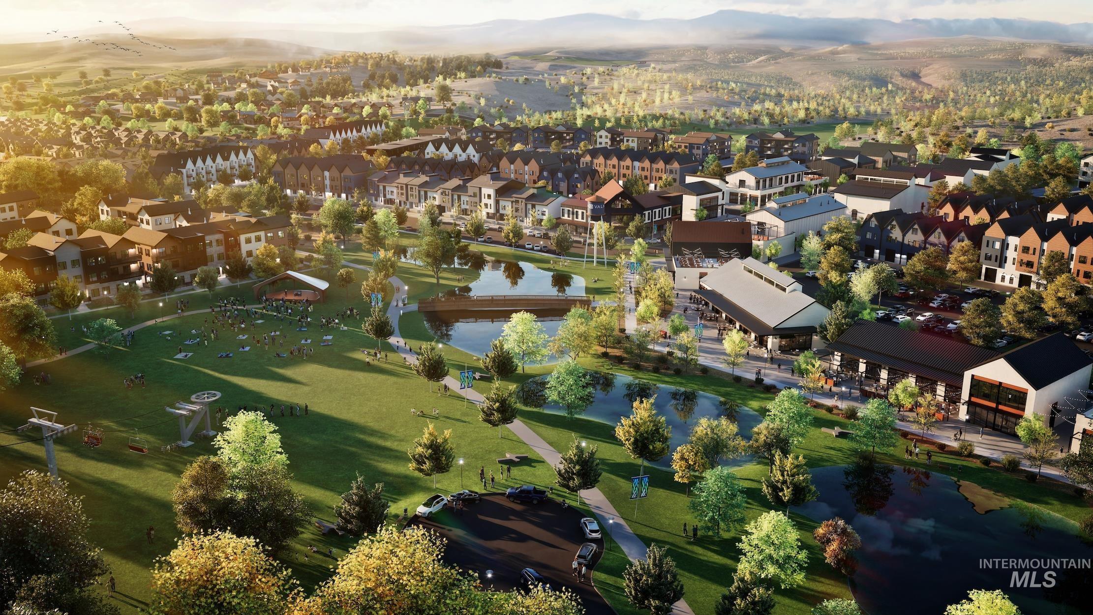 Aerial overview of property's location featuring a water and mountain view and nearby suburban area