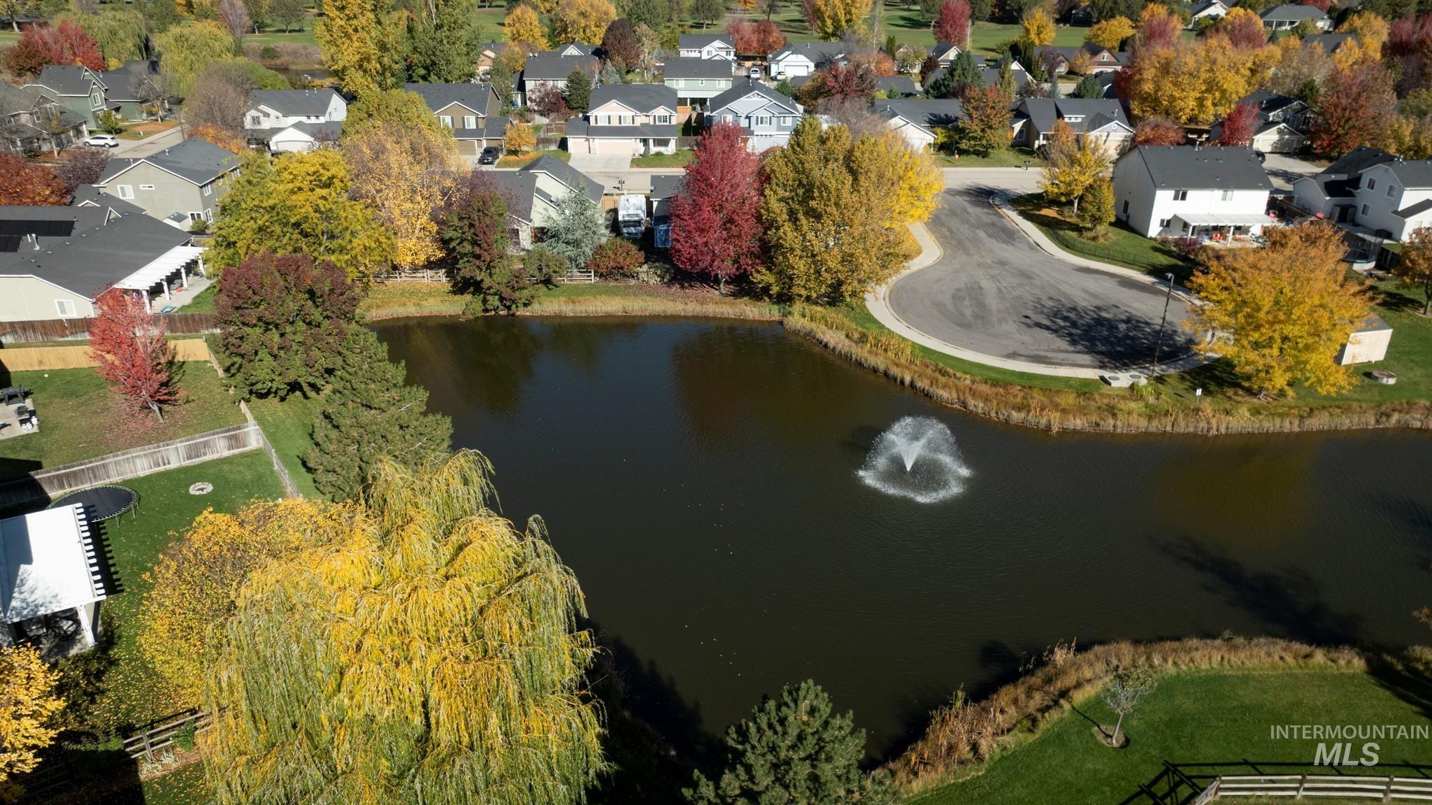 Aerial perspective of suburban area with a large body of water