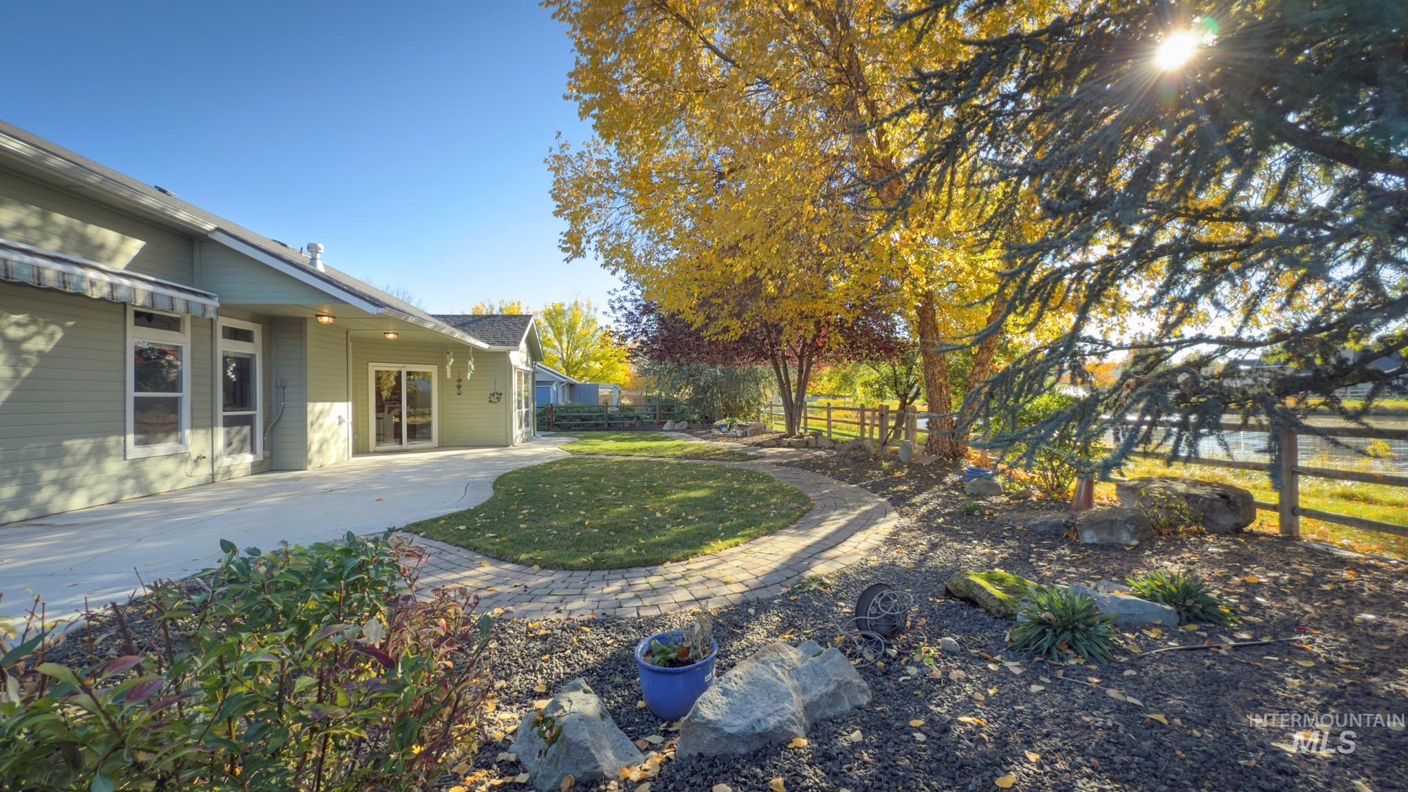 Fenced backyard with a patio