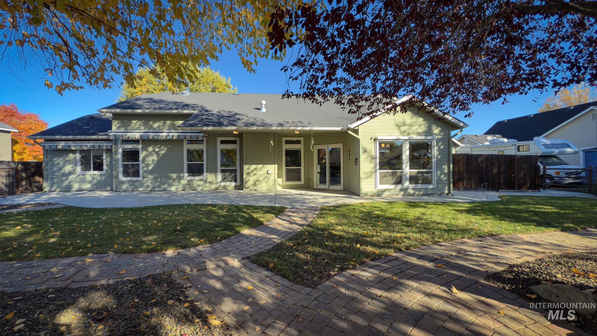 Rear view of property with a patio area